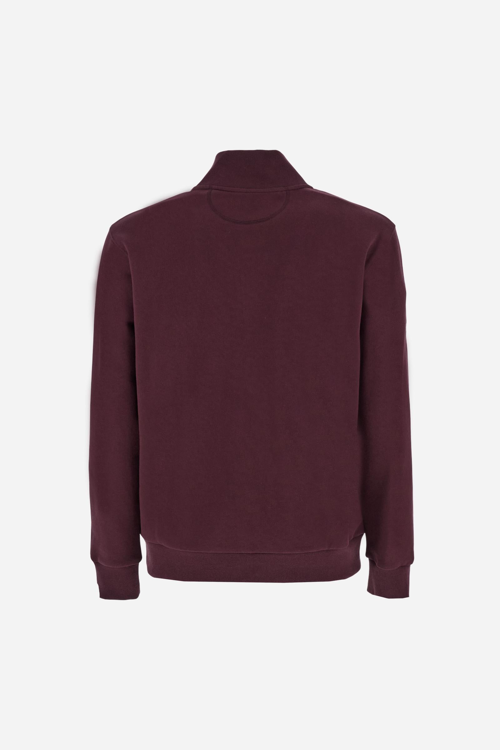 Men's long-sleeved solid colour sweatshirt. It is made of comfortable 100% cotton fleece with a soft-brushed feel. Model with high ribbed neck and front zip opening. Solid colour ribbed cuffs and waistband. The large contrasting brand team logo is embroidered on the chest. A contrasting colour fabric number patch is applied to the right sleeve. The model has a regular fit that offers a comfortable, relaxed silhouette. The model is wearing a size L. - Port Royale
