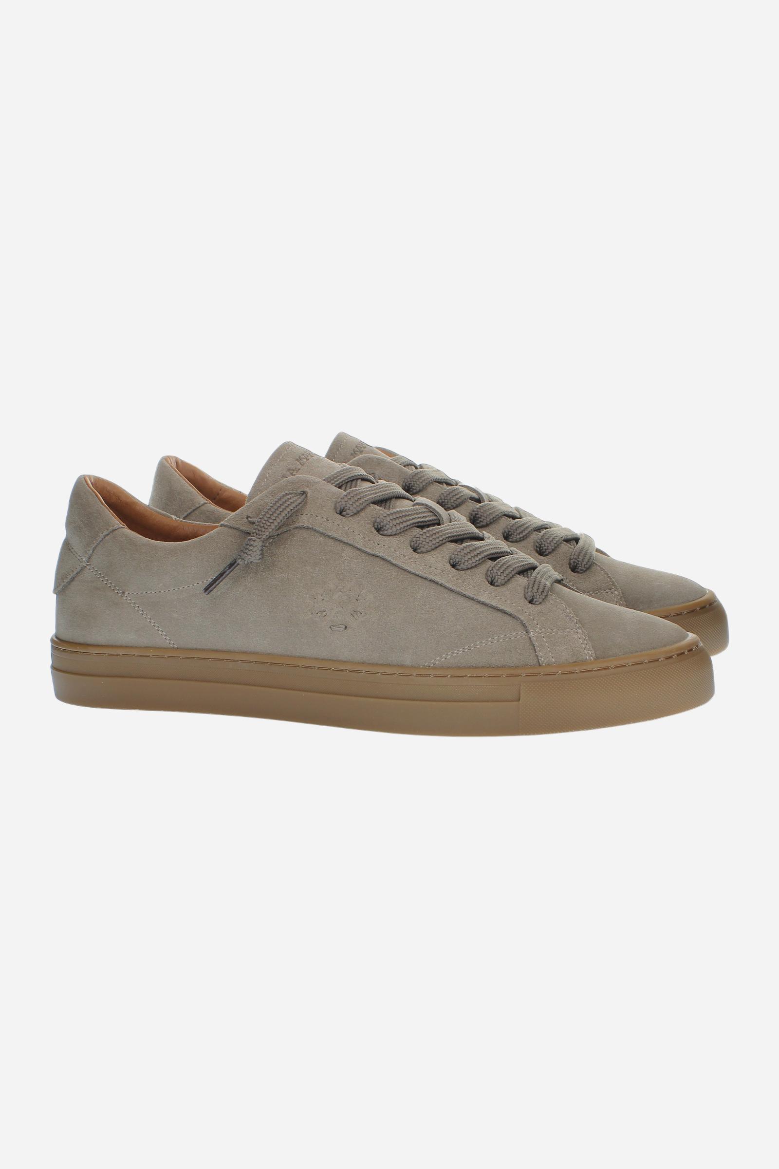 Men’s suede sneaker with flexible two-part leather tongue, hand-stitched embossed logo, amber rubber sole, and lightweight Strobel construction for all-day comfort. - Taupe Gray