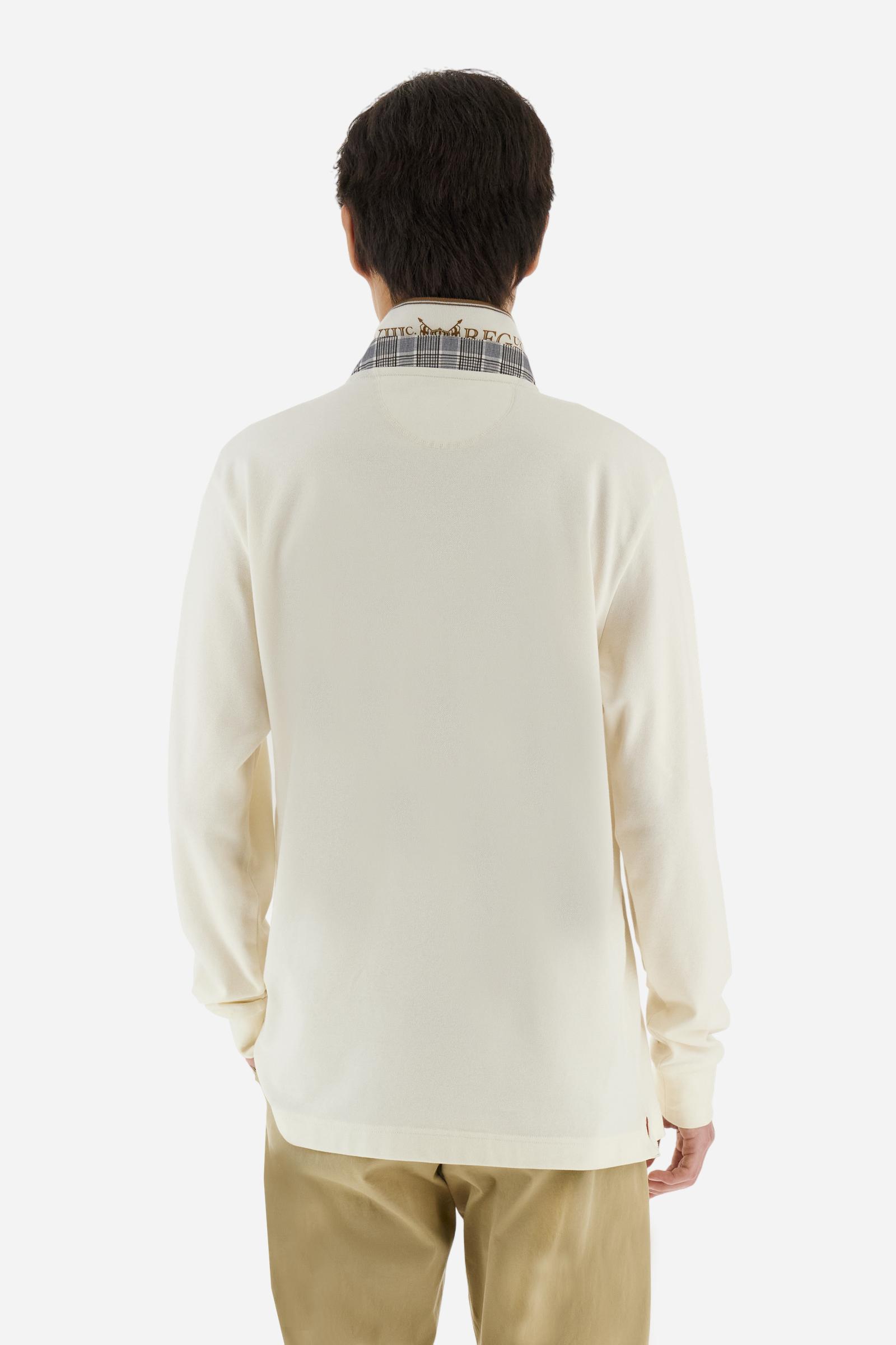 Long-sleeve polo shirt in stretch cotton jersey, soft and breathable. Ribbed collar with contrast striped edge and inner tartan ribbon. A colorful embroidered crest enriches the chest, complemented by a tonal embroidered logo under the placket with two personalized buttons. Regular fit for a versatile, timeless look. Model wears size L. - Pristine