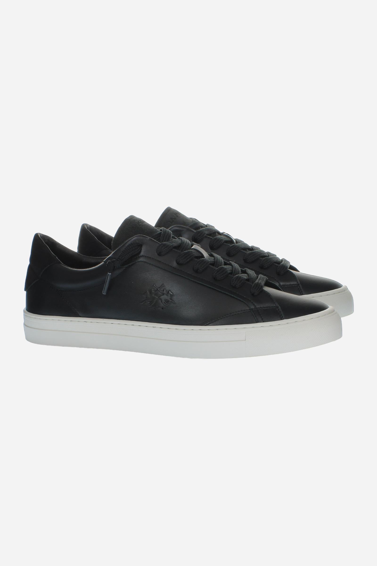 Leather sneaker blending vintage and modern style, with flexible divided tongue, nubuck heel, hand-stitched details, and a lightweight, comfortable off-white sole. - Black
