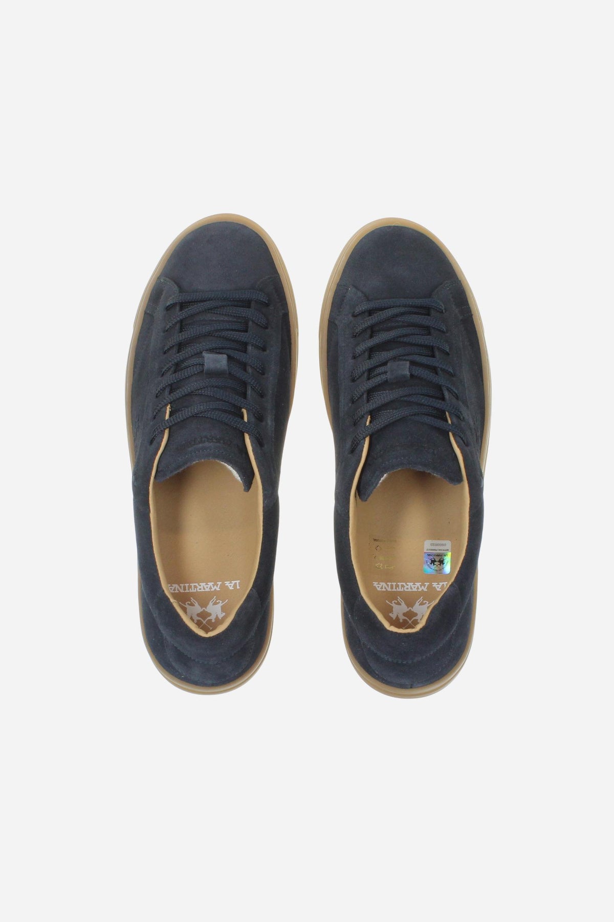 Men’s suede sneaker with flexible two-part leather tongue, hand-stitched embossed logo, amber rubber sole, and lightweight Strobel construction for all-day comfort. - Salute