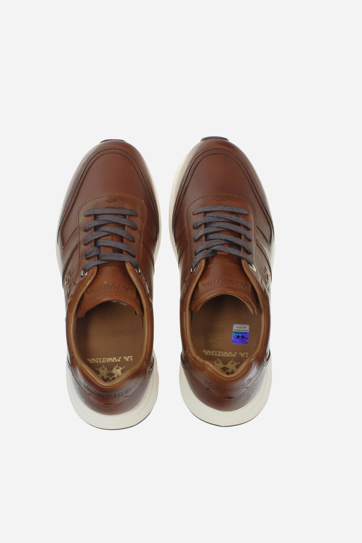Men's leather sneaker with tone-on-tone stitching, hand-stitched details, embossed logos, and a lightweight two-tone EVA sole for comfort and grip. - COGNAC