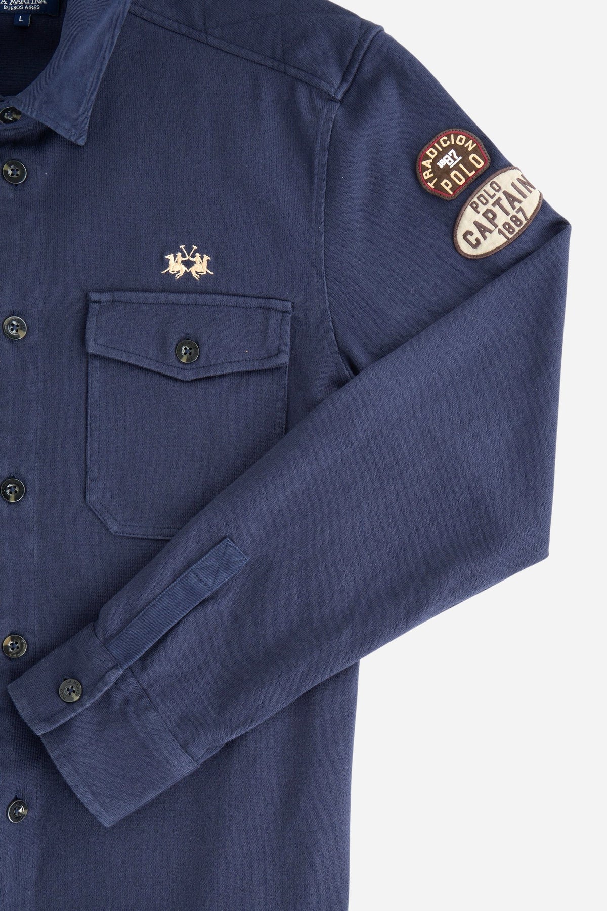 Men's long-sleeve shirt jacket in heavy cotton jersey with diamond quilting, utility flap pockets, embroidered patches, and custom faux horn buttons for a comfortable fit. - Navy Blazer