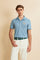Men's short-sleeve polo shirt made from solid-color stretch piqué fabric. The model features a two-button front placket with ribbed collar and cuffs in matching tone. An iconic design of the brand, it stands out for the large embroidered team logo in contrasting color on the chest and the bold brand print under the collar in contrasting color. The regular fit ensures comfort and versatility for everyday wear. The model is wearing size L. - Stone Blue                                                          