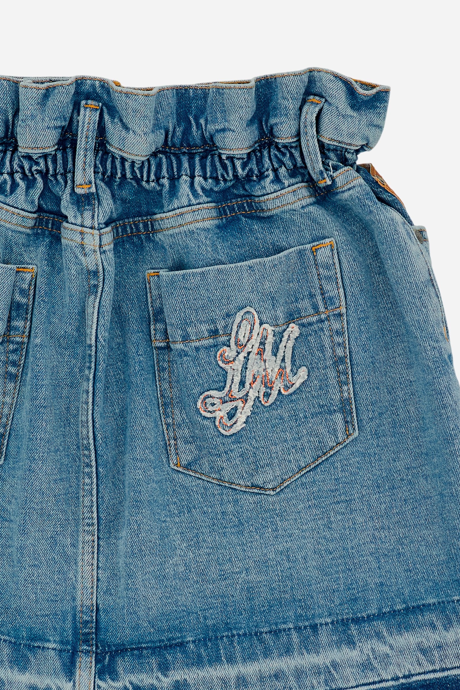 Denim mini skirt with light-medium wash and worn-in effect. Slightly flared five-pocket style with raw-cut hem and contrast pocket with logo. - Medium Indigo Denim
