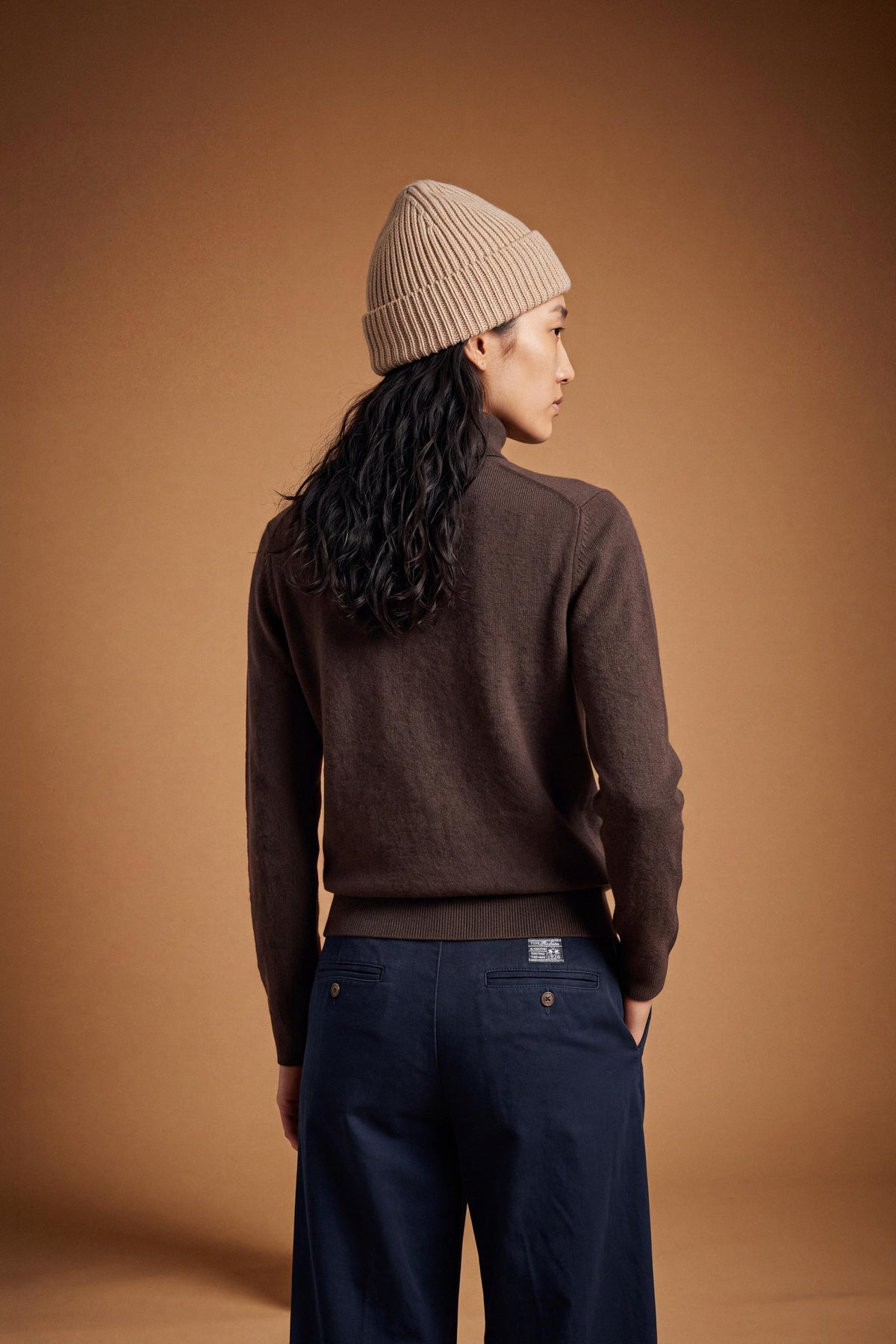 Women's lambswool turtleneck sweater with a soft, ribbed collar, fitted bust, ribbed cuffs and hem, and subtle embroidered logo for a clean, elegant look. - Hot Fudge