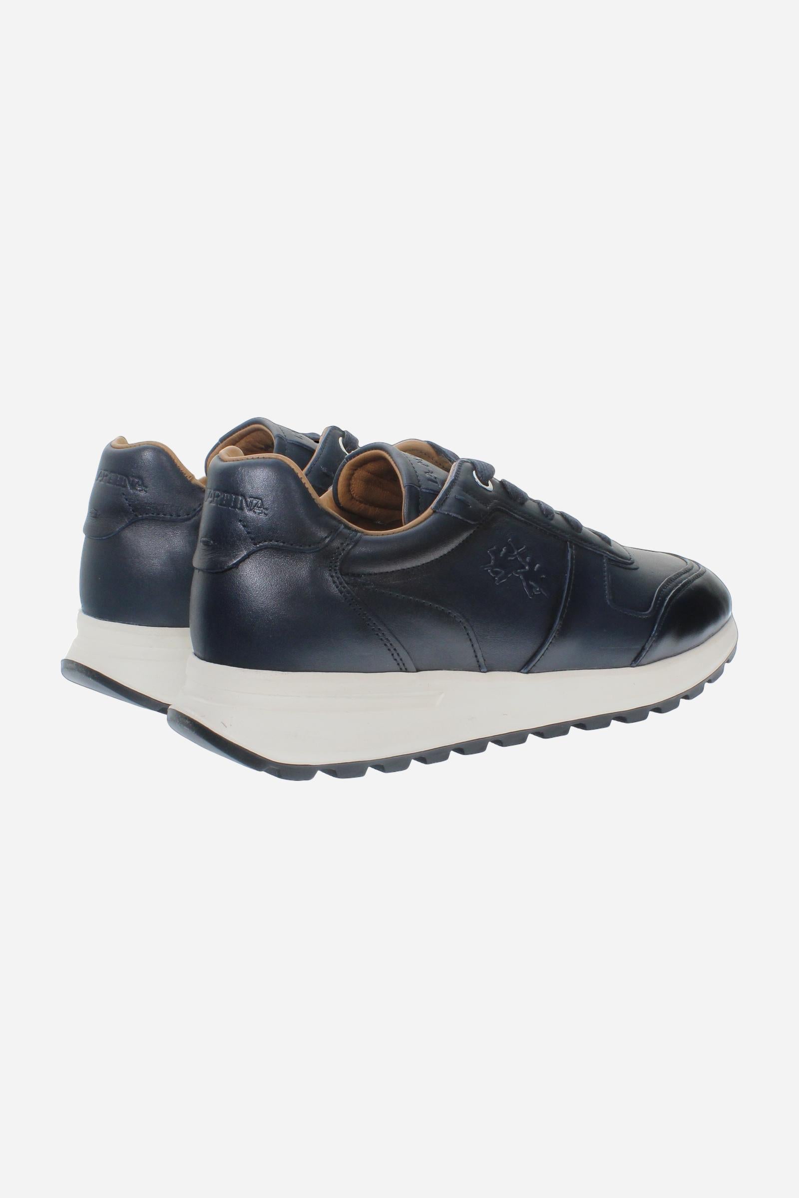 Men's leather sneaker with tone-on-tone stitching, hand-stitched details, embossed logos, and a lightweight two-tone EVA sole for comfort and grip. - Salute