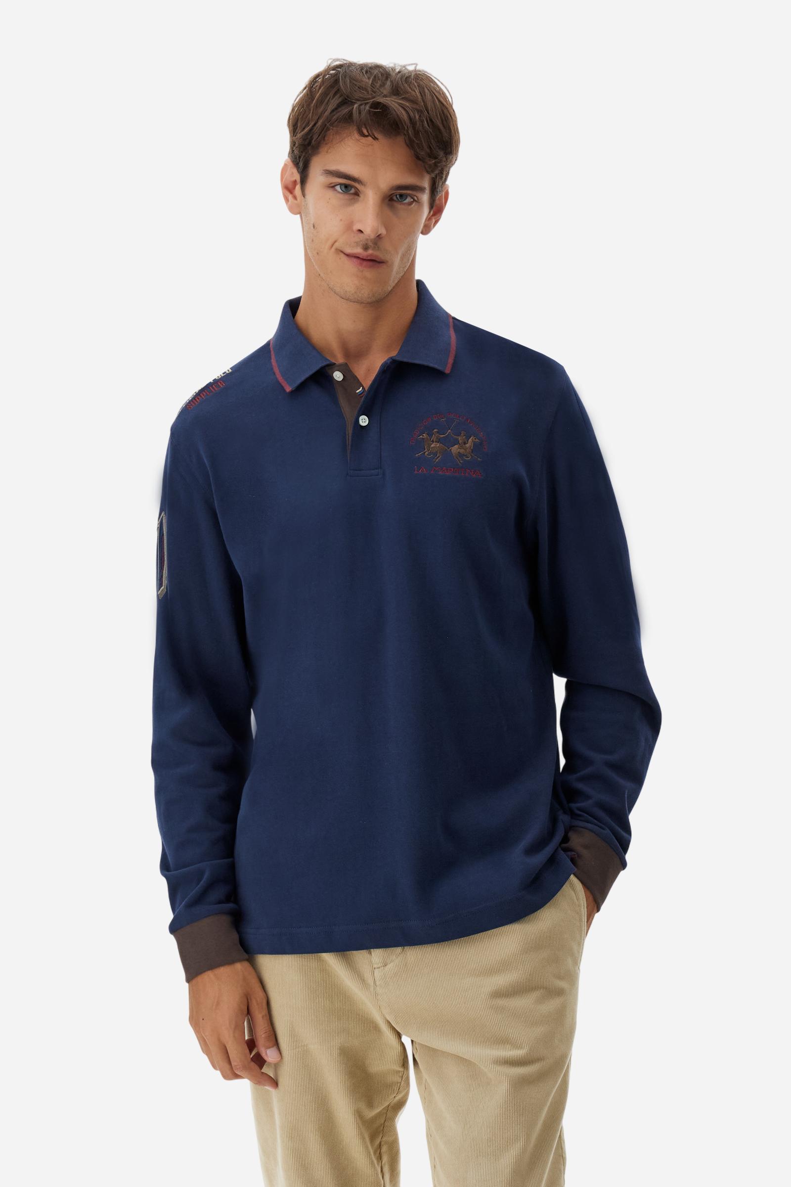 Men’s long-sleeve polo shirt in solid-colour cotton jersey with a warm, matte handfeel. Ribbed collar and cuffs with stripes and colour blocks in contrast, two personalised buttons and contrast details inside the collar. Patches and graphics on sleeves and chest celebrate the Official Polo Supplier team. The large multicolour logo is embroidered on the chest. Regular fit. The model wears size L. - Navy