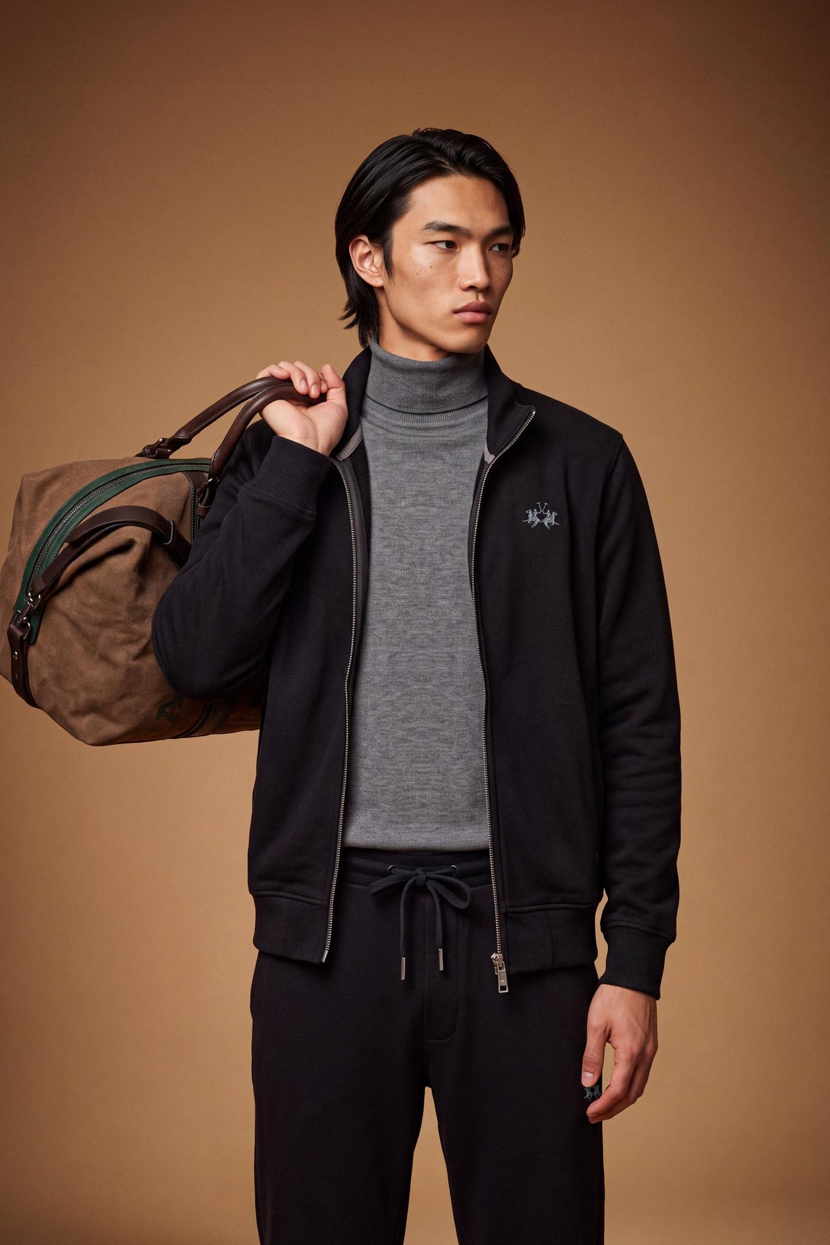 Men's 100% cotton fleece sweatshirt with a high collar, customized zipper, ribbed cuffs and hem, regular fit, and a subtle embroidered logo for comfort and style. - Black