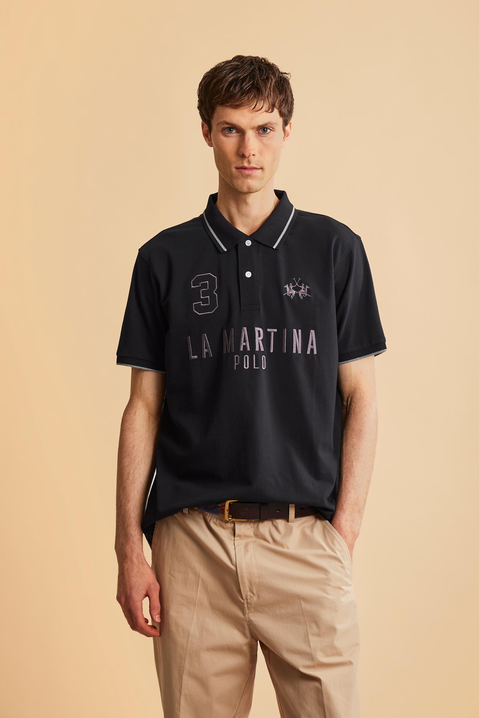 Men's short-sleeve polo in stretch piqué fabric with ribbed details, embroidered logo, bold lettering, and a relaxed regular fit for versatile comfort. - Black