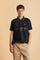 Men's short-sleeve polo in stretch piqué fabric with ribbed details, embroidered logo, bold lettering, and a relaxed regular fit for versatile comfort. - Black