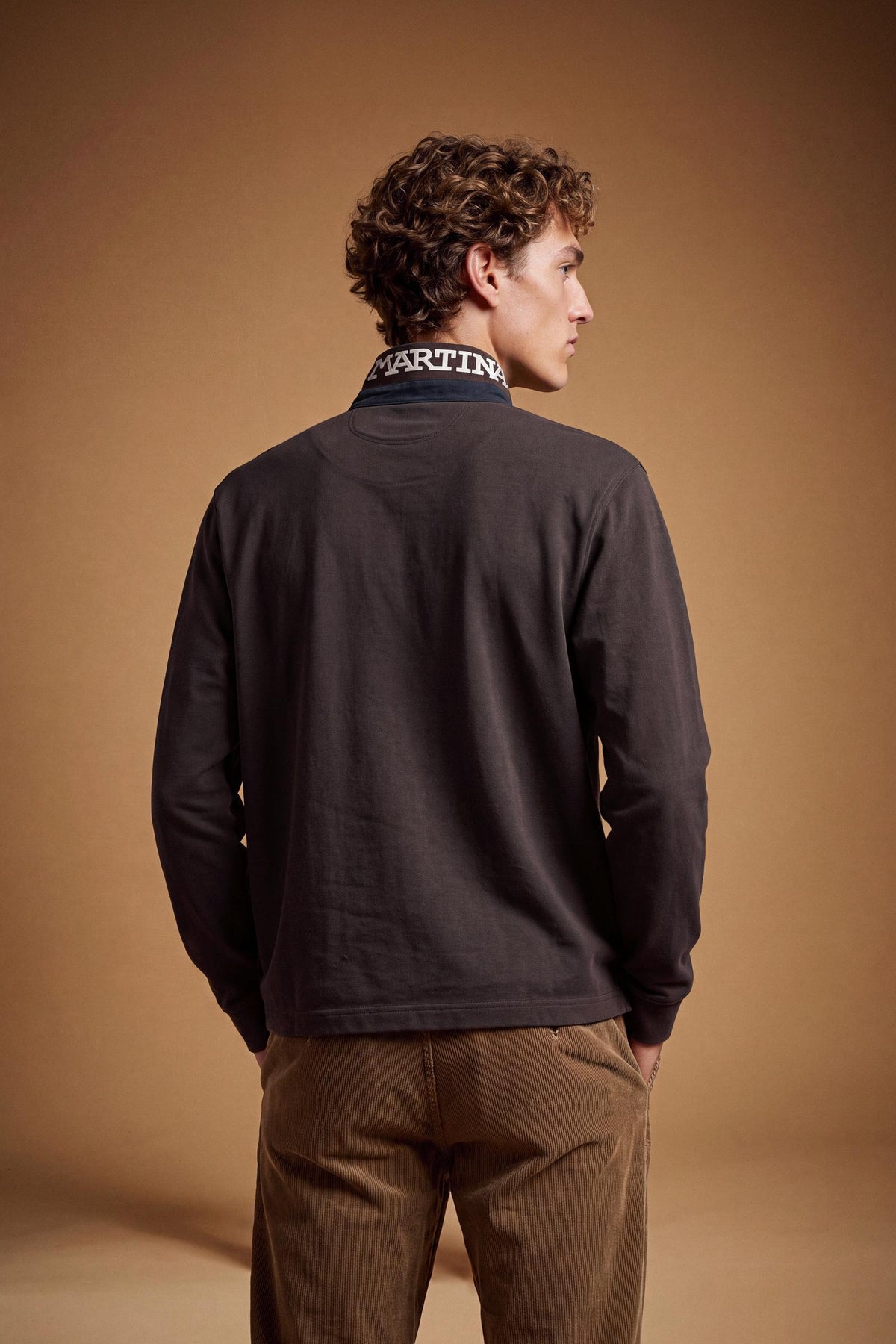 Men's long-sleeve polo in soft cotton jersey with contrasting gabardine collar, ribbed details, multicolor striped placket, and embroidered team logo for comfor - Hot Fudge