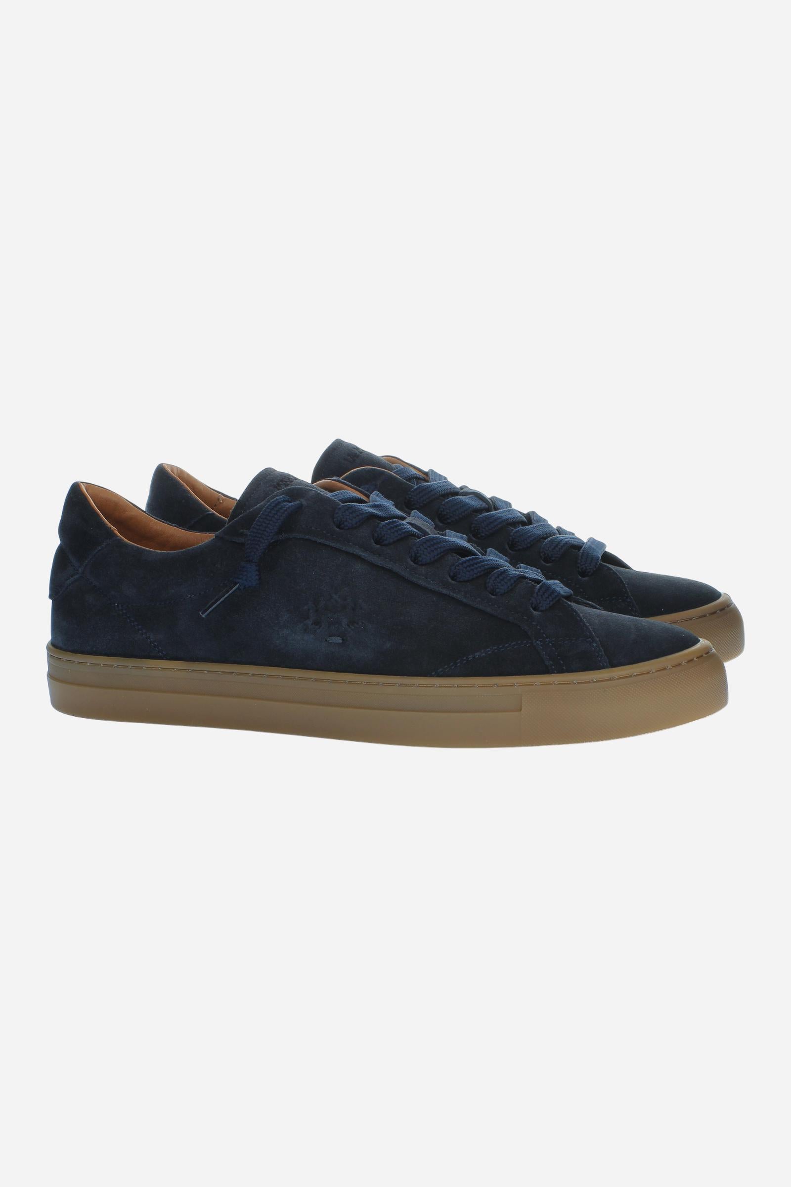 Men’s suede sneaker with flexible two-part leather tongue, hand-stitched embossed logo, amber rubber sole, and lightweight Strobel construction for all-day comfort. - Salute