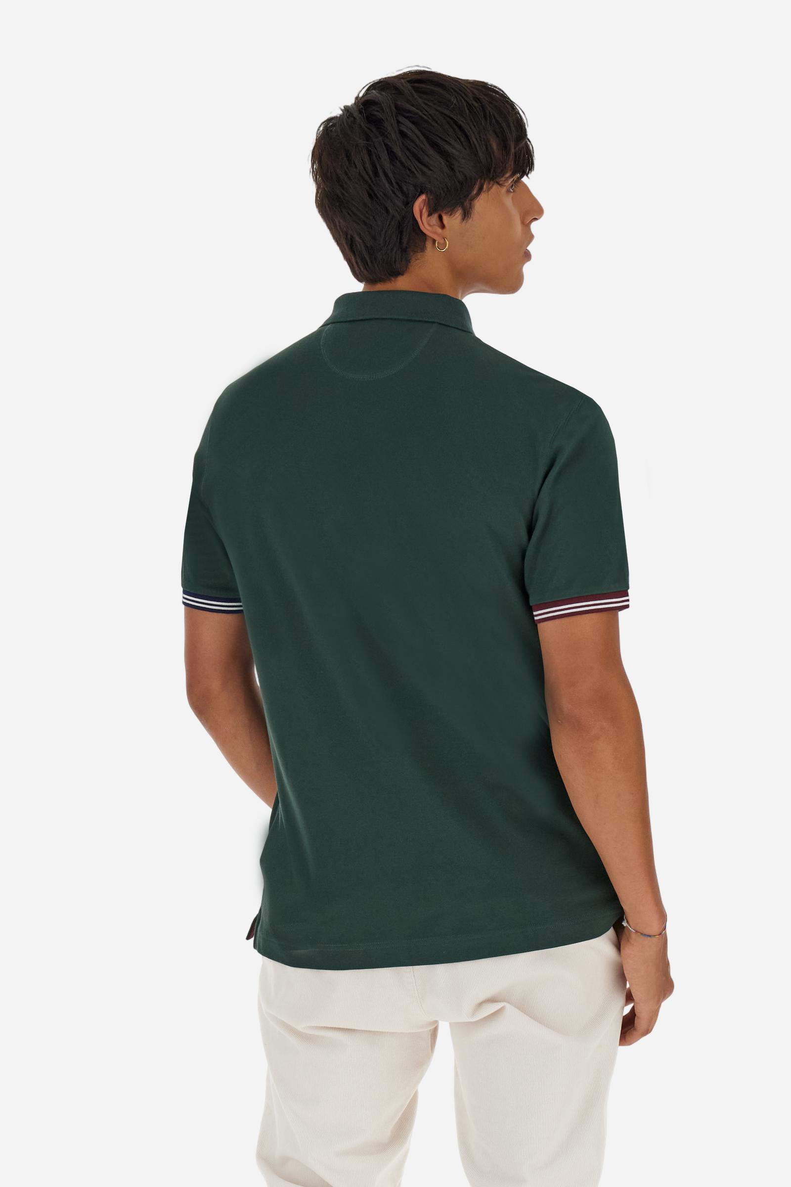 Men’s short-sleeve polo in high-quality stretch cotton piqué, ensuring excellent breathability and flexibility. Classic ribbed collar, two-button placket with customized buttons. Inner collar enriched with contrast tapes and colors for a modern touch. Multicolored ribbed cuffs with different patterns. Small contrast logo embroidered on the chest. Regular fit. Model wears size L. - Sycamore
