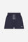 Bermuda shorts for girls made from soft 100% cotton fleece in a solid colour. The style features a regular fit, short leg and elasticated waist with adjustable drawstring. The small contrast embroidered brand logo on the left leg adds a discreet and distinctive detail. A comfortable, versatile garment, ideal for casual and sporty looks. - Navy