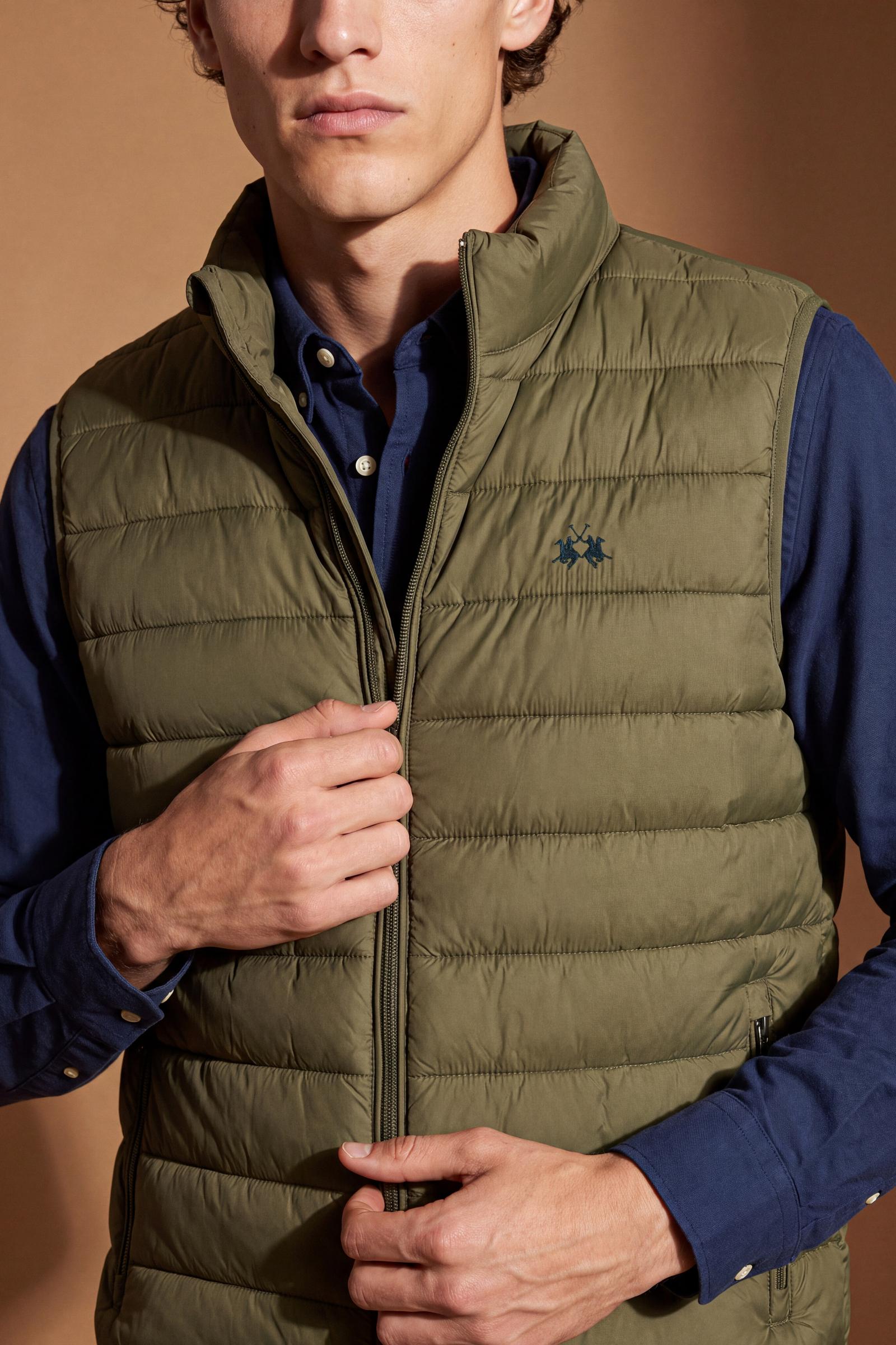 Men's sleeveless down jacket in lightweight nylon with wadding padding for warmth, zippered pockets, high collar, and contrasting interior and logo details. - Burnt Olive