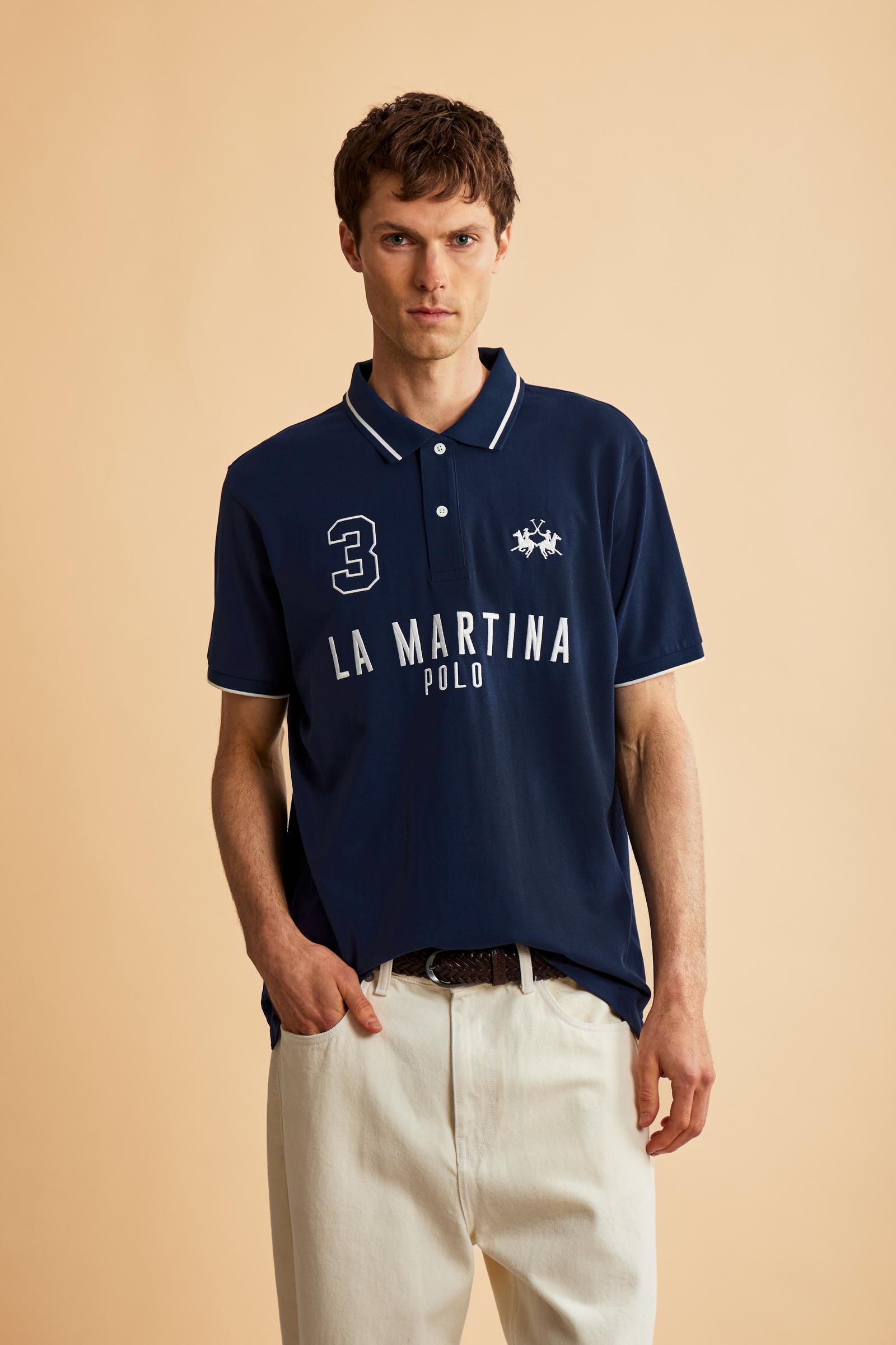 Men's short-sleeve polo in stretch piqué fabric with ribbed details, embroidered logo, bold lettering, and a relaxed regular fit for versatile comfort. - Navy