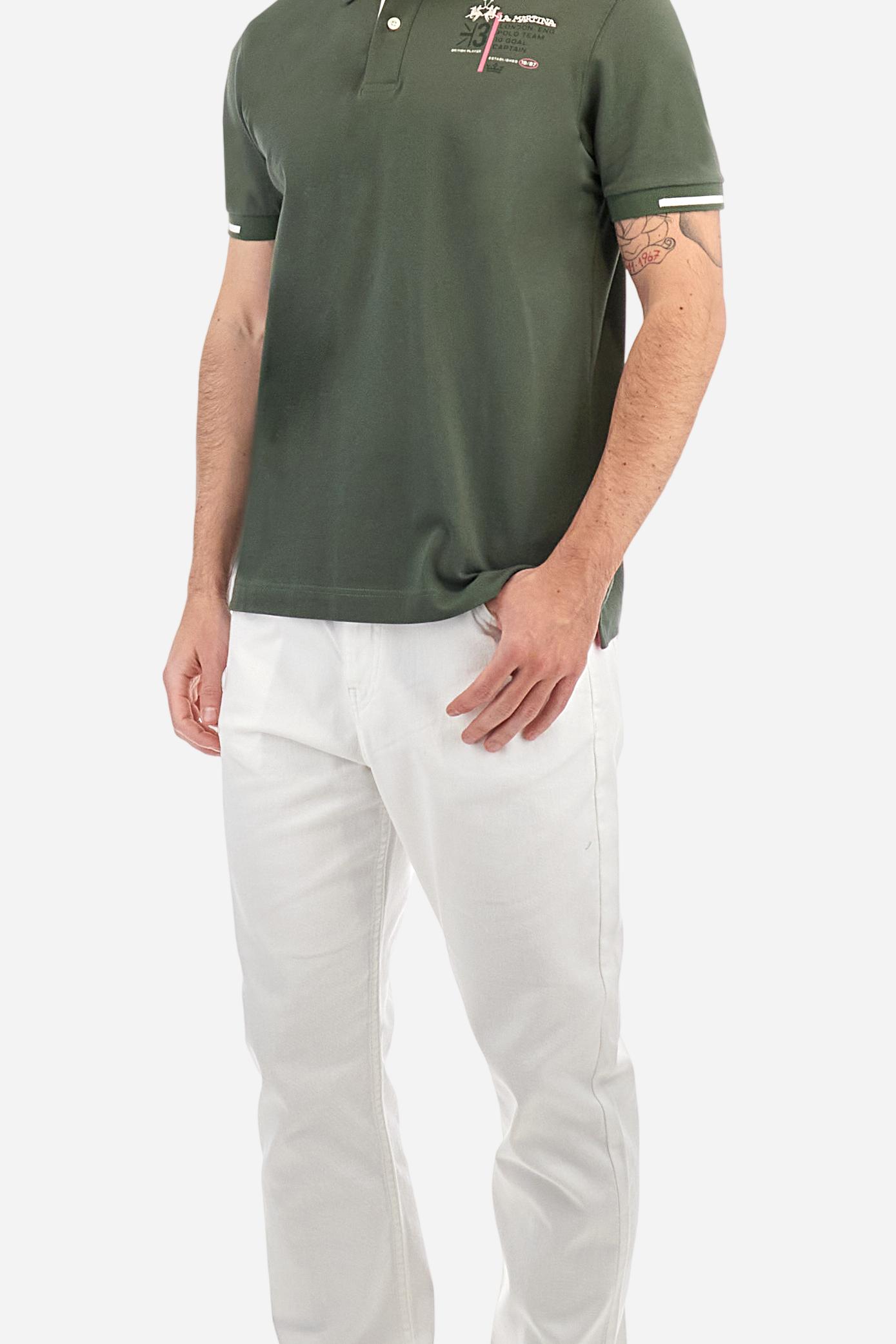 Short-sleeved, single-colour men's polo shirt made of stretch cotton piqué. Fastens with two buttons and internal opening, button side, in contrasting fabric. Ribbed collar and cuffs. The cuffs feature an inlaid detail in a contrasting colour. The graphics on the chest and back are made with mixed techniques: printing and embroidery. The logo is embroidered on the chest, left side. The fit is regular. The model is wearing a size L. - Thyme