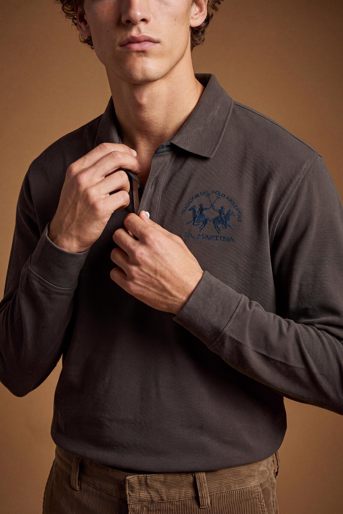 Men's long-sleeve polo in soft cotton jersey with contrasting gabardine collar, ribbed details, multicolor striped placket, and embroidered team logo for comfor - Hot Fudge