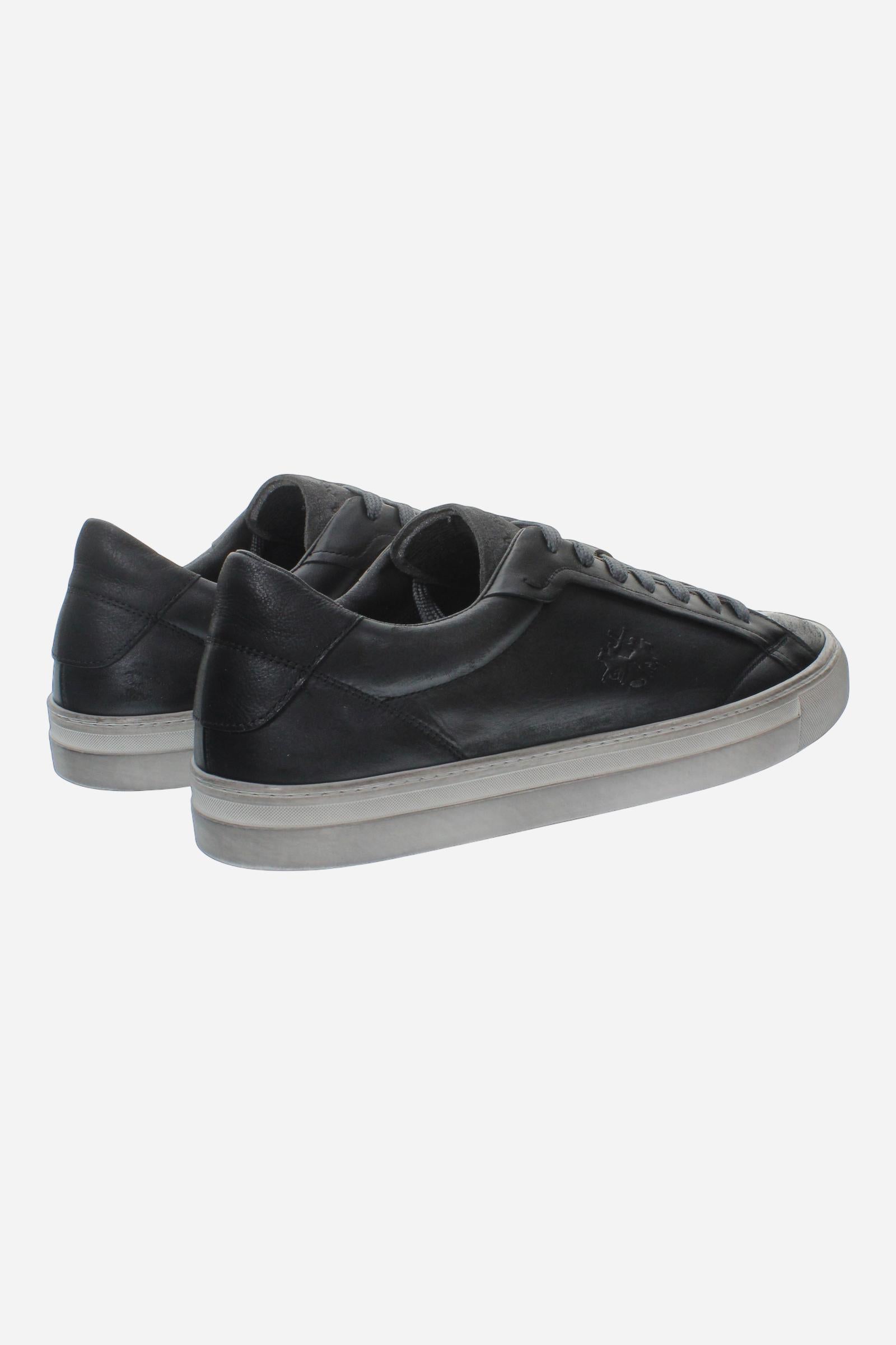 Leather sneaker blending vintage and modern style, with flexible divided tongue, nubuck heel, hand-stitched details, and a lightweight, comfortable off-white sole. - Black