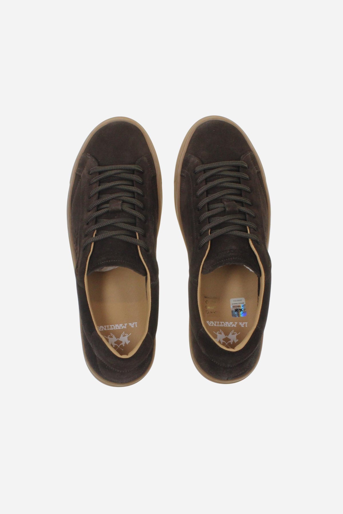 Men’s suede sneaker with flexible two-part leather tongue, hand-stitched embossed logo, amber rubber sole, and lightweight Strobel construction for all-day comfort. - Dark Brown