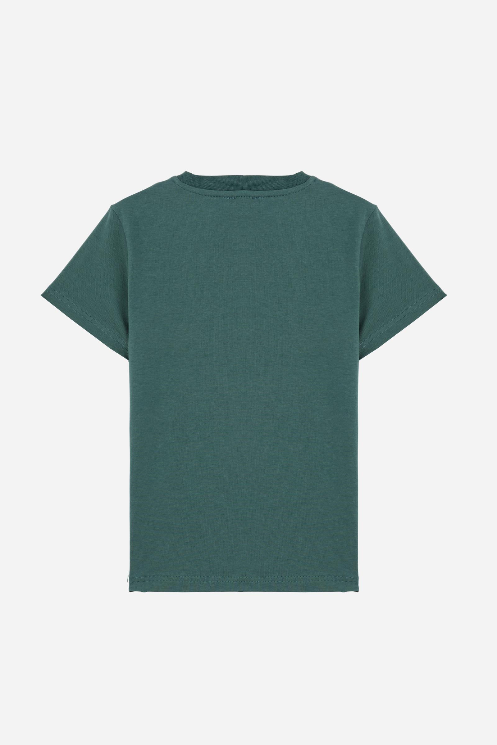 Short-sleeved T-shirt for girls made from soft 100% cotton jersey in a solid colour. The style features a regular fit and tonal ribbed crew neck. The maxi front print, featuring the iconic crossed polo players logo and La Martina lettering, enhances the garment with a sporty and recognisable style. - Pineneedle