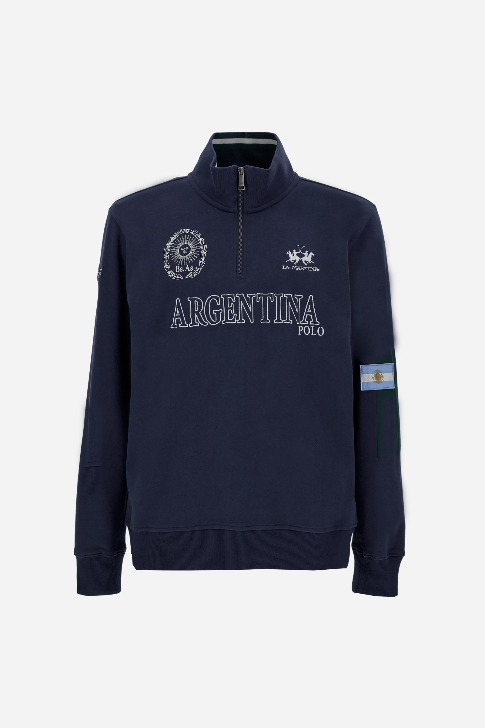 Men's long-sleeved solid colour sweatshirt in cotton. Made of pure cotton fabric with a soft, velvety touch. Practical half-zip opening and ribbed cuffs and collar details. Vivid multi-coloured with Argentina-inspired graphics on the chest and sleeves. The logo is embroidered on the left side of chest for a subtle touch of branding. The fit is regular to suit everyday wear. The model is wearing a size L. - Navy