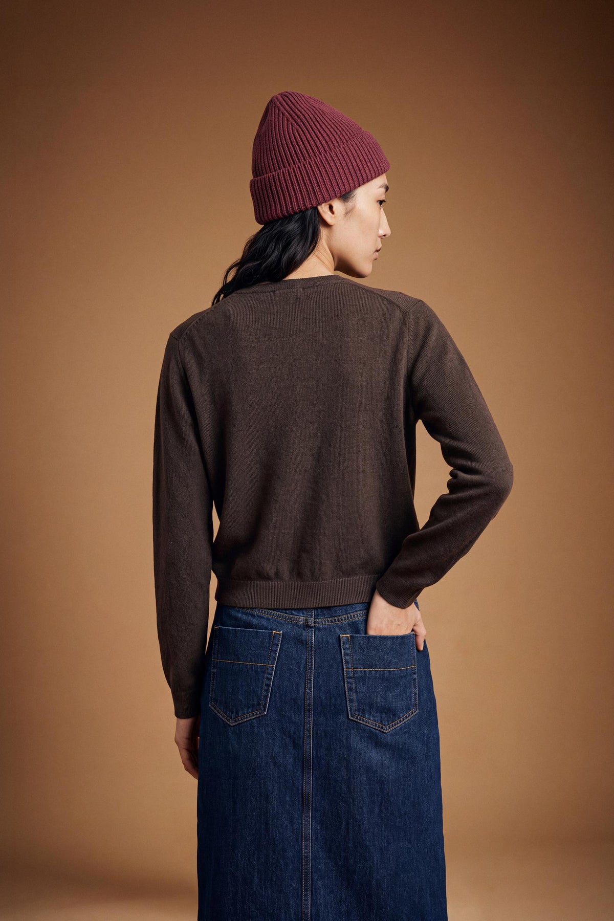 Soft lambswool blend cardigan with a smooth knit, regular fit, cropped length, ribbed crew neck, cuffs, hem, and subtle front button closure for a refined look. - Hot Fudge