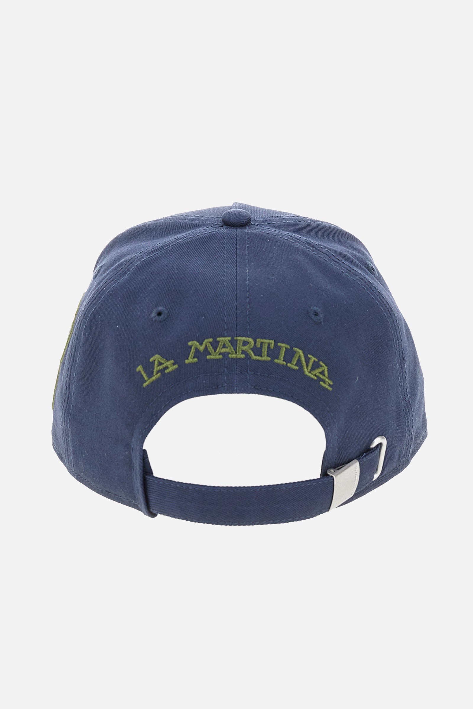 Unisex solid colour, pure cotton, peaked baseball cap. The brand's maxi team logo features on the front, embroidered in a contrasting colour, while a number patch finished with embroidered cordonnet thread is applied to the side. The back is embellished with La Martina lettering, also embroidered in a contrasting colour above the opening. The adjustable fastening is completed by a custom metal buckle, which ensures comfort and a perfect fit every time. - Navy