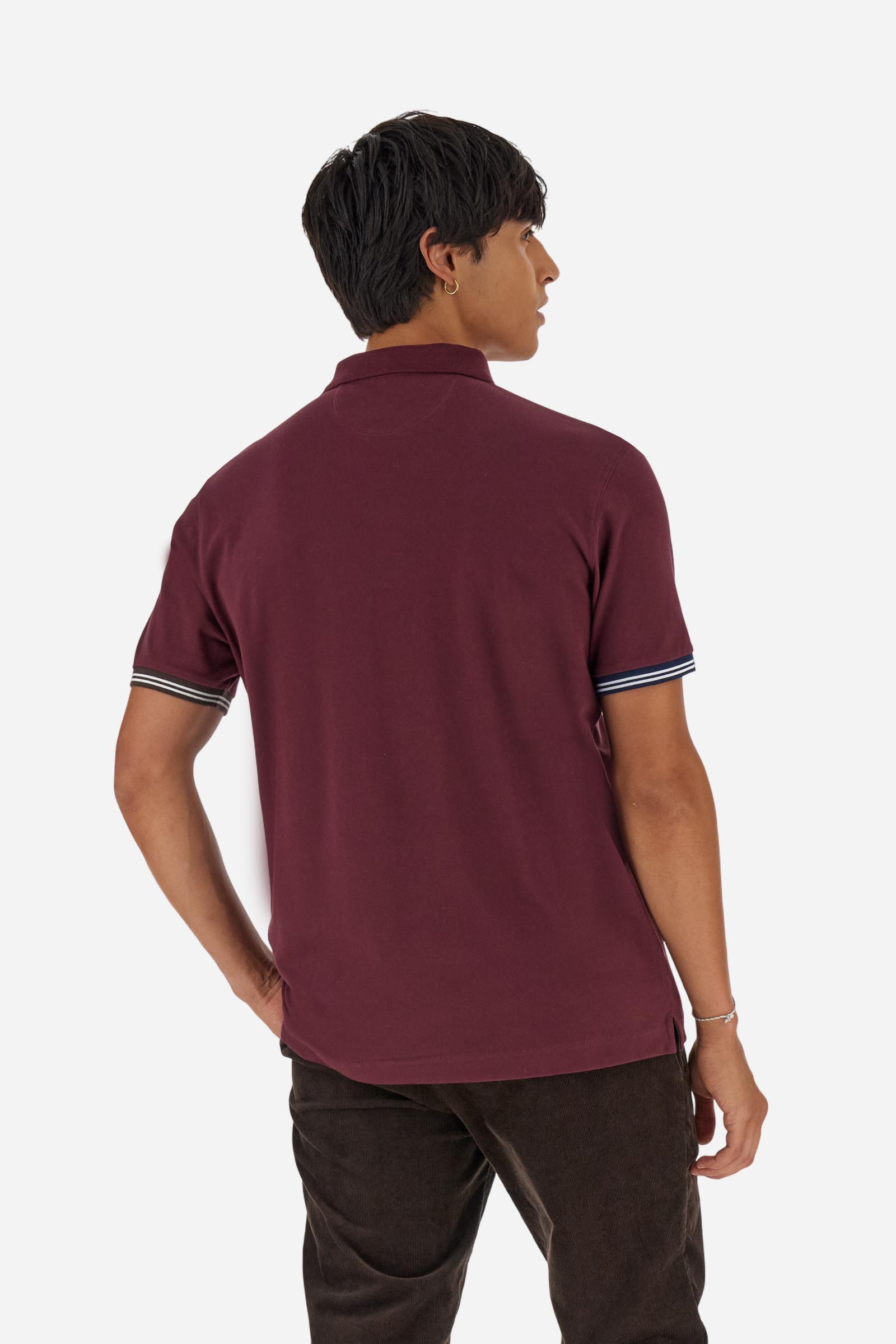 Men’s short-sleeve polo in high-quality stretch cotton piqué, ensuring excellent breathability and flexibility. Classic ribbed collar, two-button placket with customized buttons. Inner collar enriched with contrast tapes and colors for a modern touch. Multicolored ribbed cuffs with different patterns. Small contrast logo embroidered on the chest. Regular fit. Model wears size L. - Port Royale