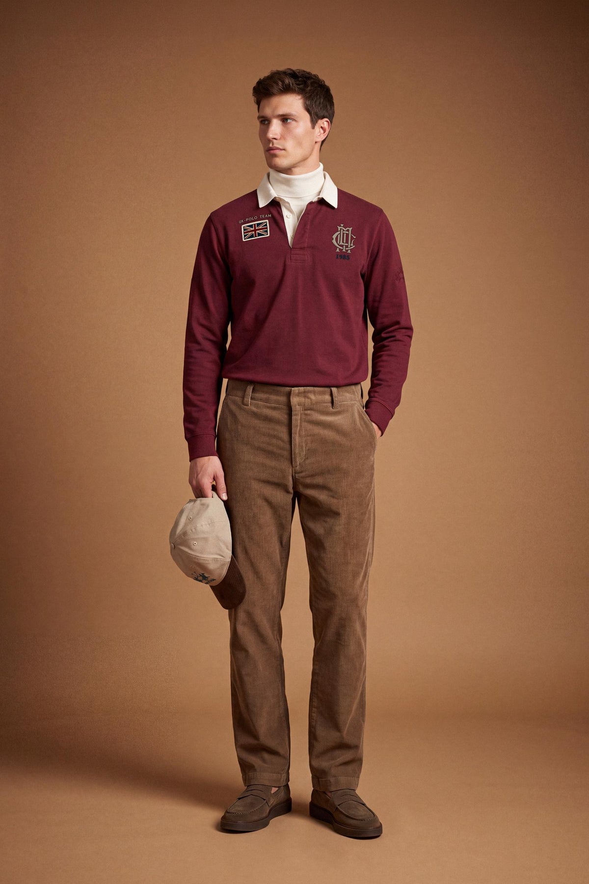 Men’s long-sleeve polo in heavy pure cotton jersey with textured fabric, hidden placket, ribbed cuffs, and heritage British polo graphic for a classic, clean fit. - Red Dahlia
