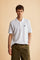 Men’s short sleeve cotton piqué polo shirt with regular fit, two-button placket and contrast brand logo. - Optic White