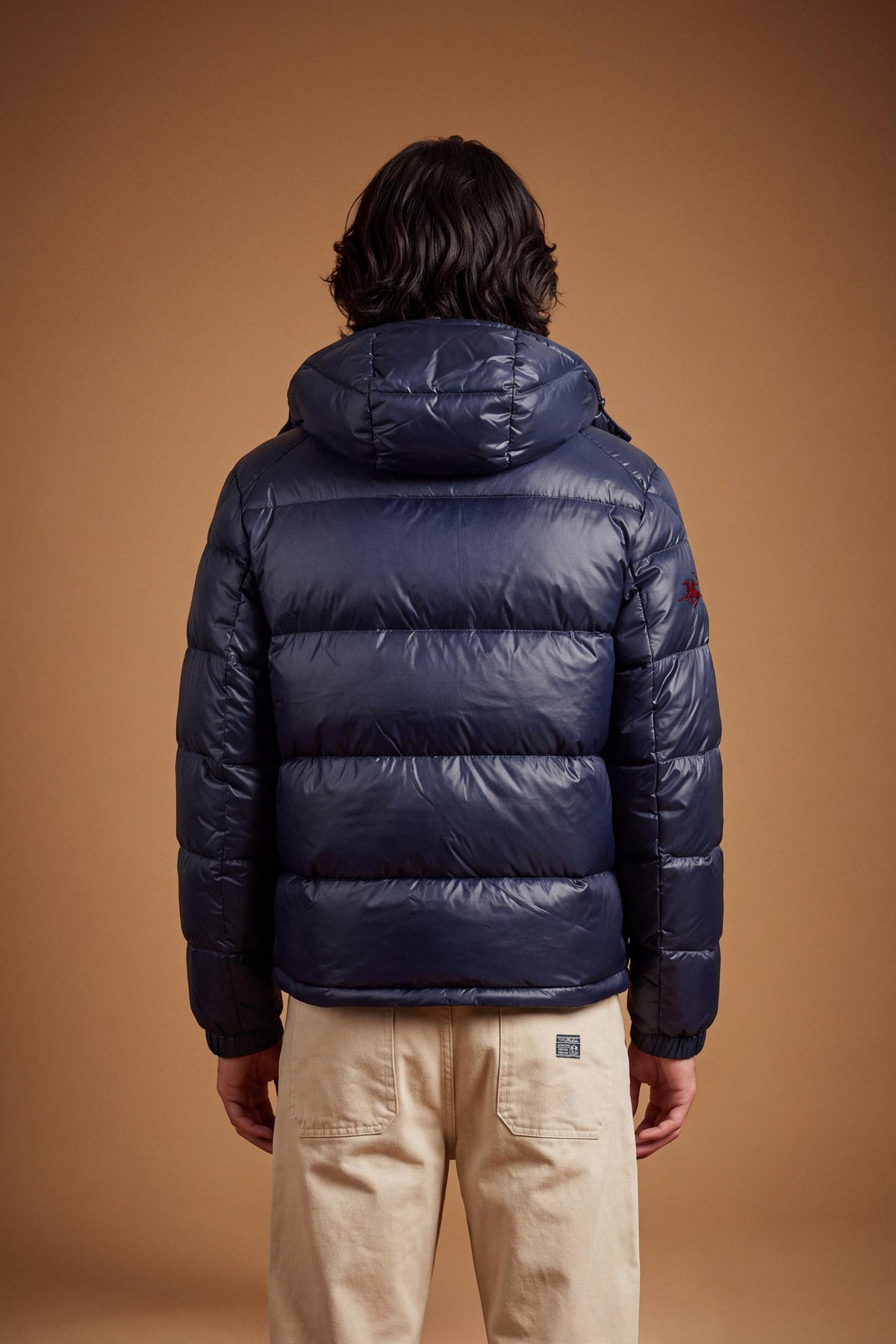 Men's padded feather bomber jacket with detachable hood, iridescent nylon, double zipper, snap buttons, adjustable drawstring, zippered pockets, and embroidered logo. - Navy Blazer