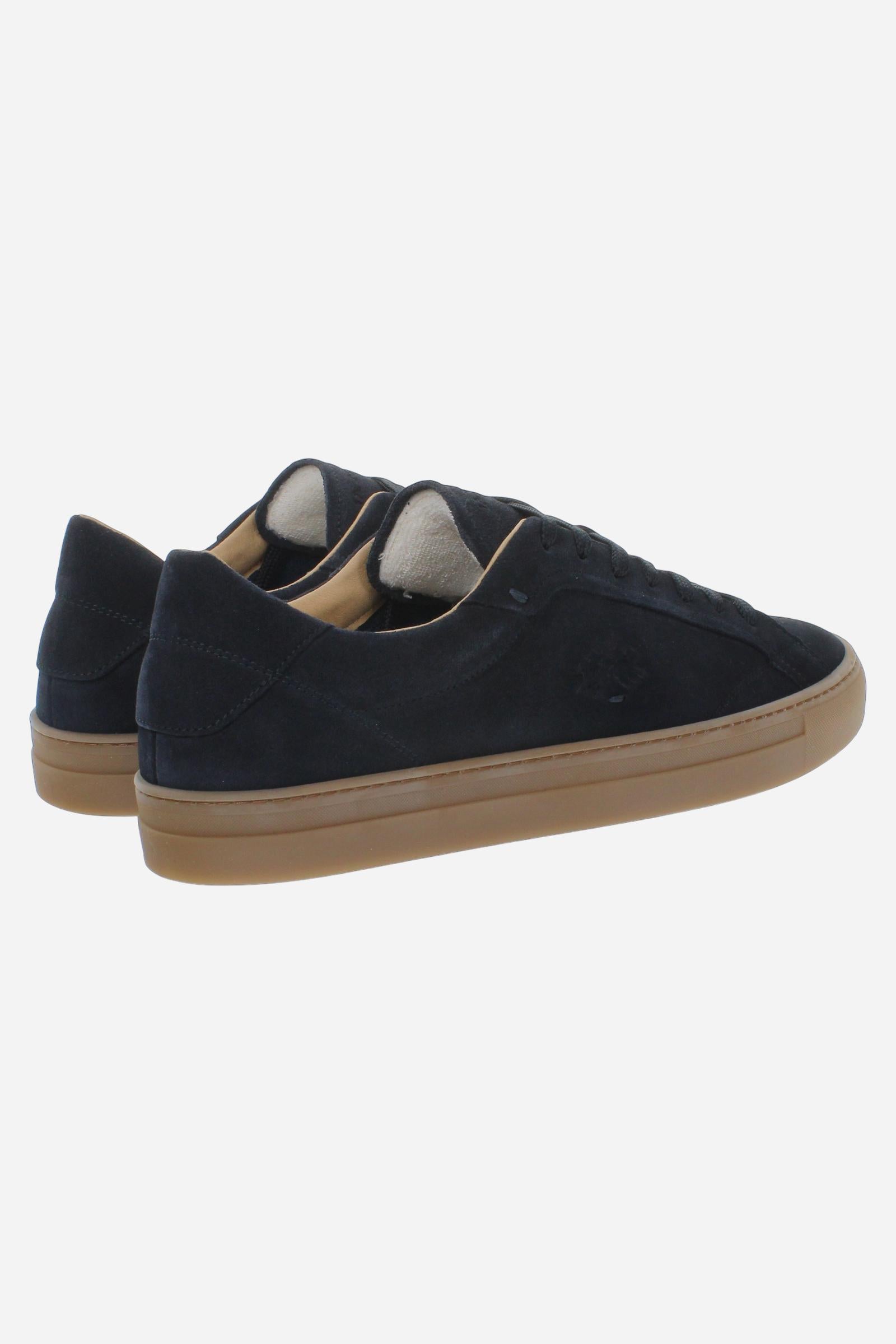 Men’s suede sneaker with flexible two-part leather tongue, hand-stitched embossed logo, amber rubber sole, and lightweight Strobel construction for all-day comfort. - Salute