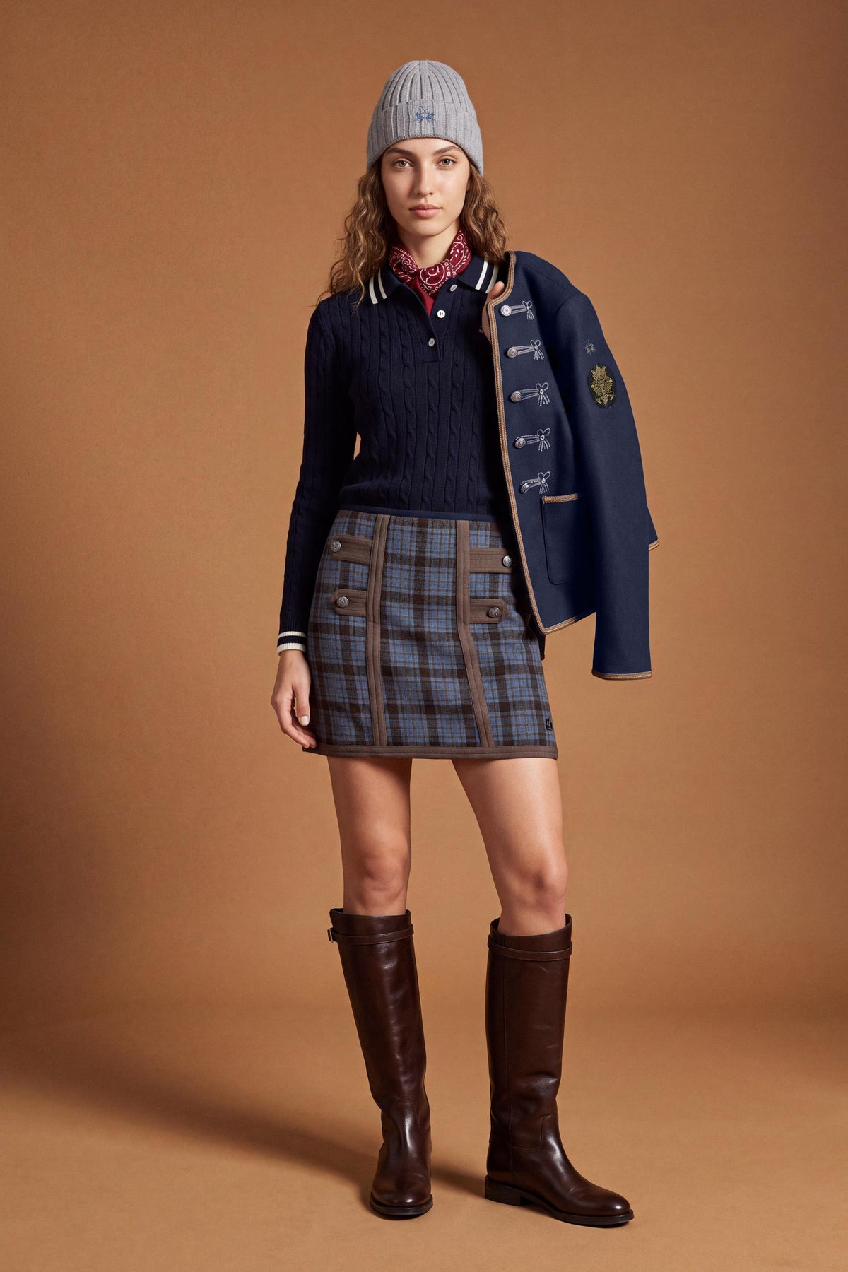 Women's long-sleeve polo in soft lambswool blend, featuring a vertical cable knit, contrast-edged collar, ribbed cuffs, and a slim, comfortable fit. - Navy
