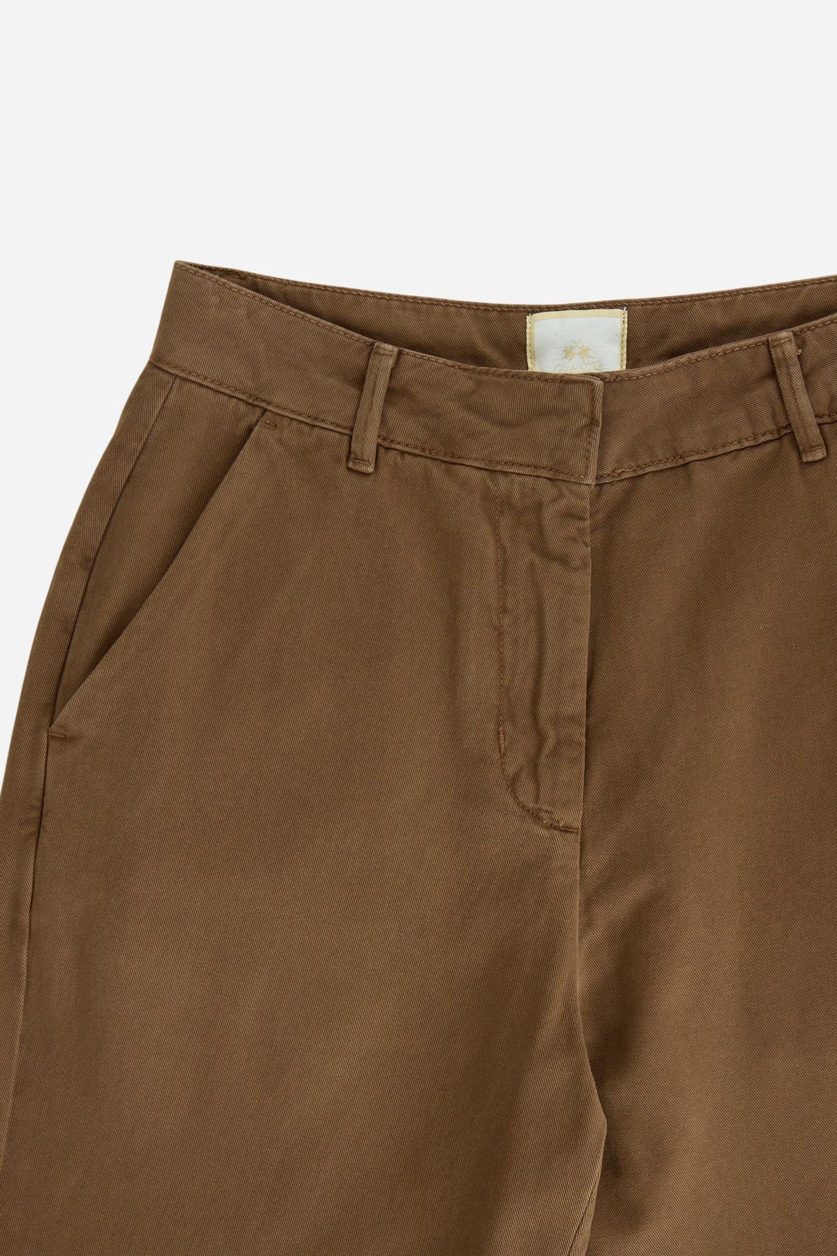 Women’s 100% cotton twill trousers with a regular hip fit, wide flared legs, belt loops, front zipper, button closure, side pockets, and buttoned back pockets. - Carafe