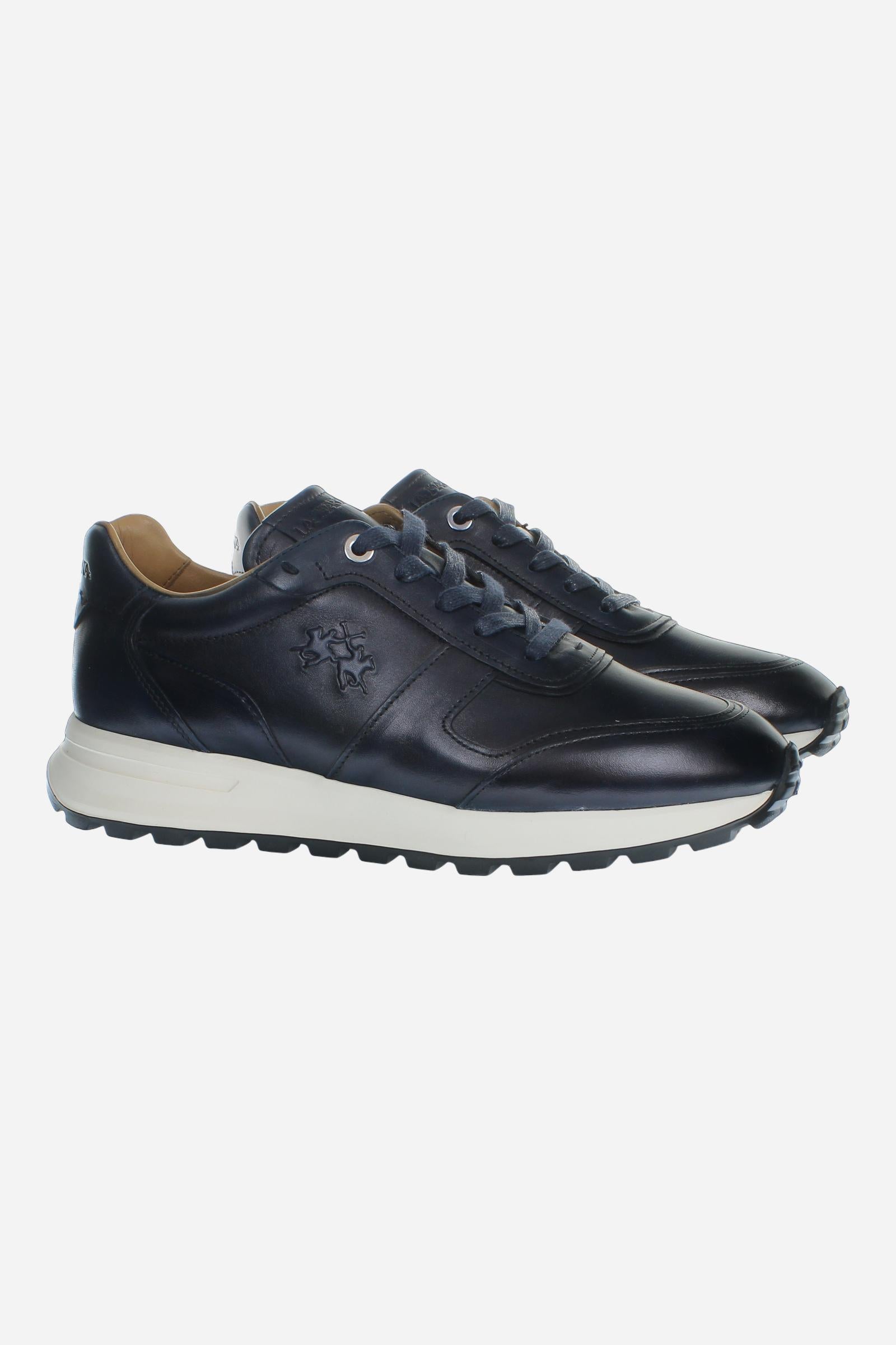 Men's leather sneaker with tone-on-tone stitching, hand-stitched details, embossed logos, and a lightweight two-tone EVA sole for comfort and grip. - Salute
