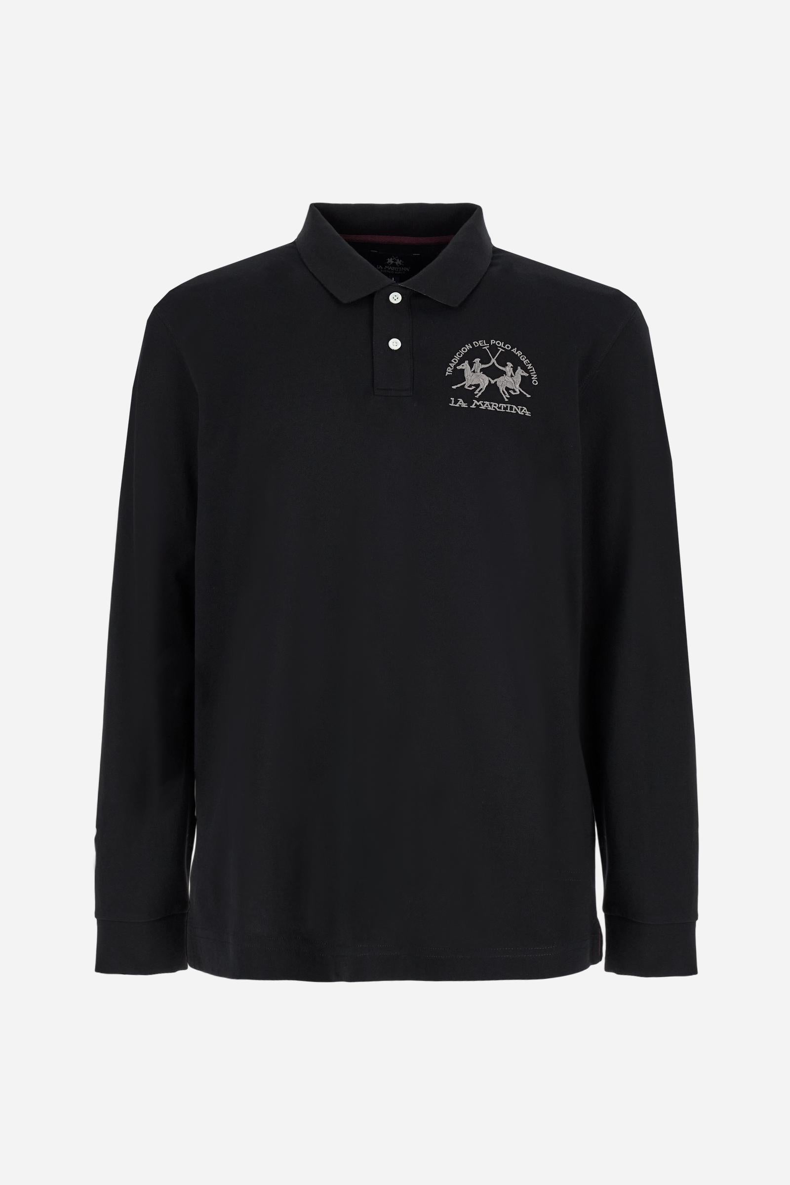 Men's long-sleeved solid colour polo shirt. Made of high-quality stretch Piqué. The collar and cuffs are in solid colour ribbing. The undercollar features a print of the iconic La Martina lettering in a contrasting colour. Featuring a logo embroidered on the chest in a contrasting colour. On the back at the bottom, the guarantee label typical of the brand's iconic models is applied. Regular fit. The model is wearing a size L. - Black