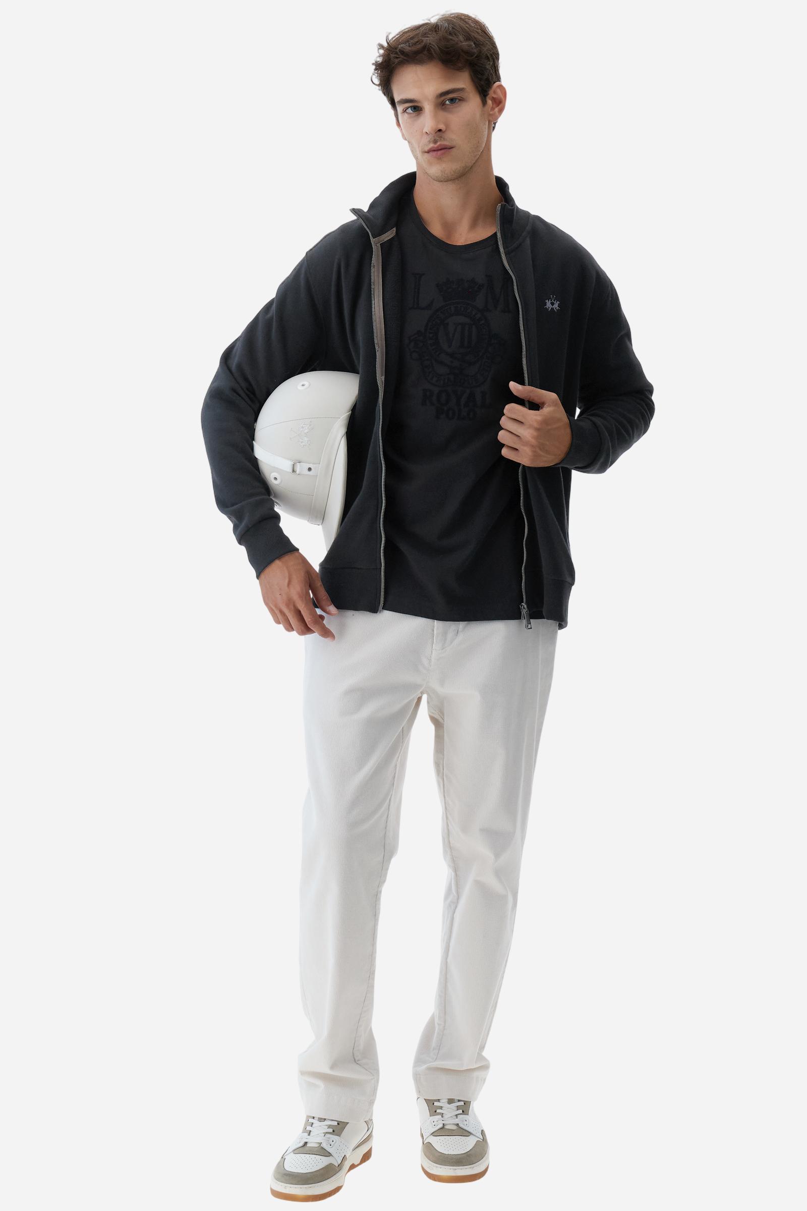 Men’s long-sleeved T-shirt in solid-colored 100% cotton jersey for breathable comfort and softness. Crew neck with ribbed collar and contrasting inner details. Minimalist design enhanced by a large flock print on the chest, celebrating Royal Polo for the Guards capsule. Small contrasting embroidered logo and Guards crest patch visible on the left sleeve. Regular fit for a classic silhouette, not too tight or too loose. Model wears size L. - Black