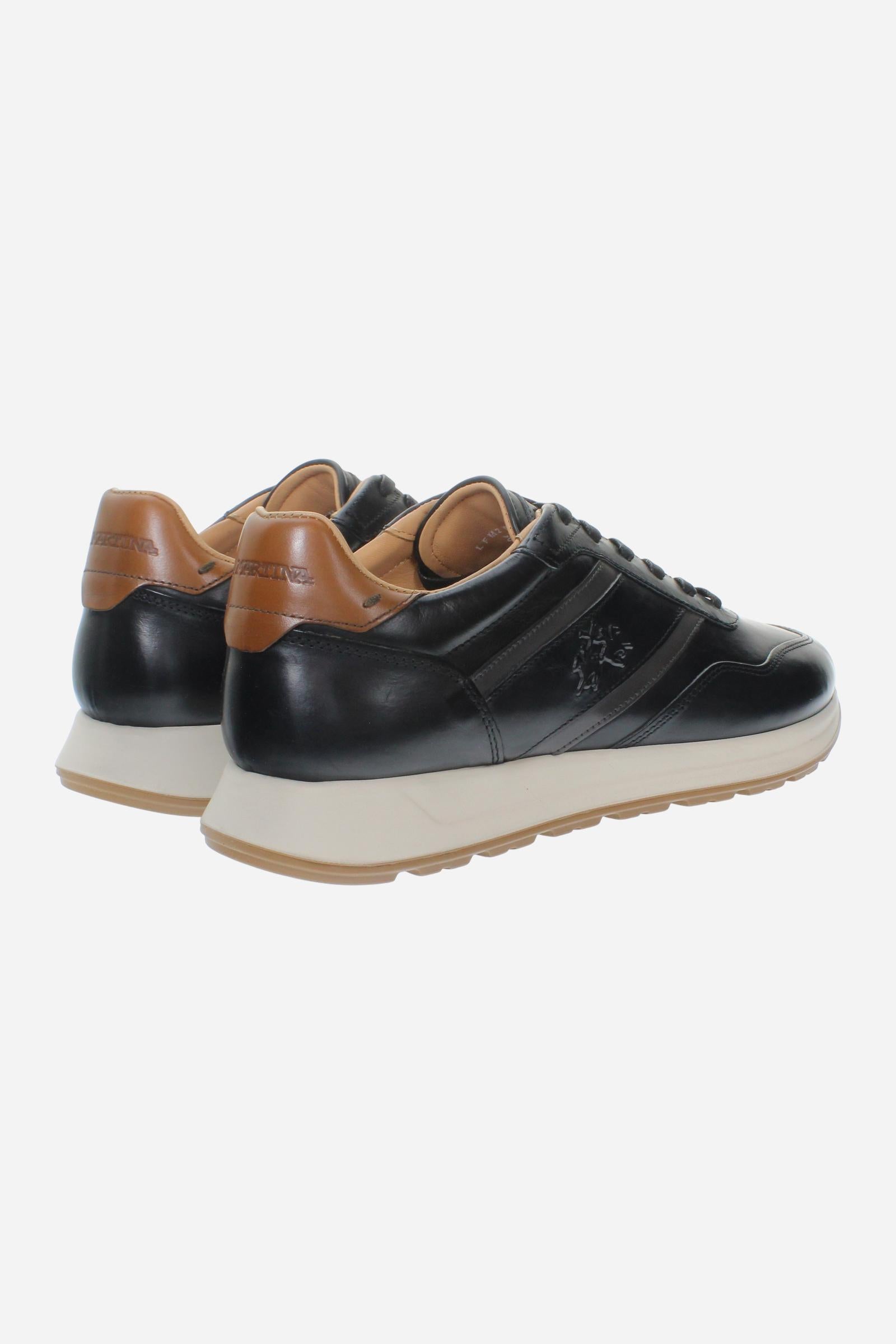 Men's sneaker combining calf and vegetable-tanned leather with artisanal stitching, branded logo, and high-cushioning rubber PU sole for lasting comfort and style. - Black