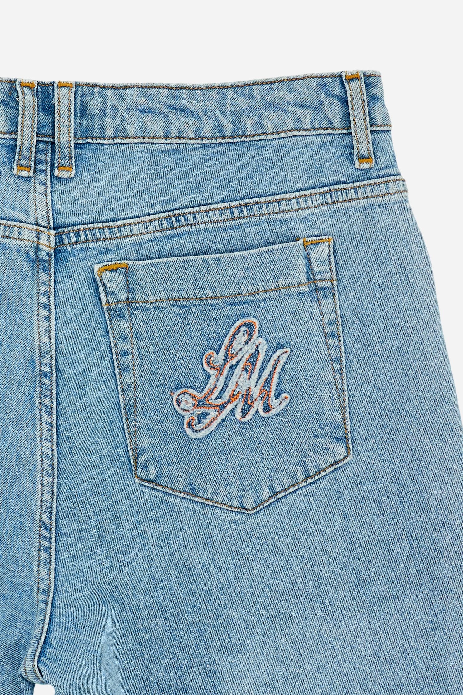 Women’s cotton denim jeans with contrast raw-cut hem. Light-medium wash with subtle natural sanding, contrast pocket and embroidered monogram on the back pocket. - Medium Indigo Denim                                                                                                                                                                                                                                                                                                                                         