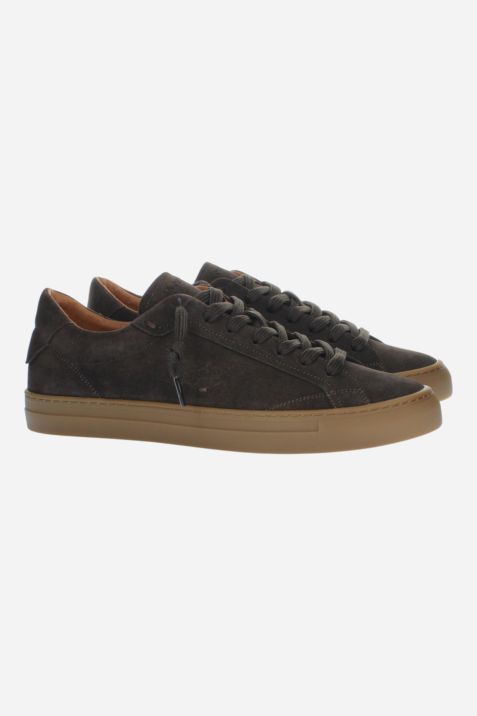 Men’s suede sneaker with flexible two-part leather tongue, hand-stitched embossed logo, amber rubber sole, and lightweight Strobel construction for all-day comfort. - Dark Brown