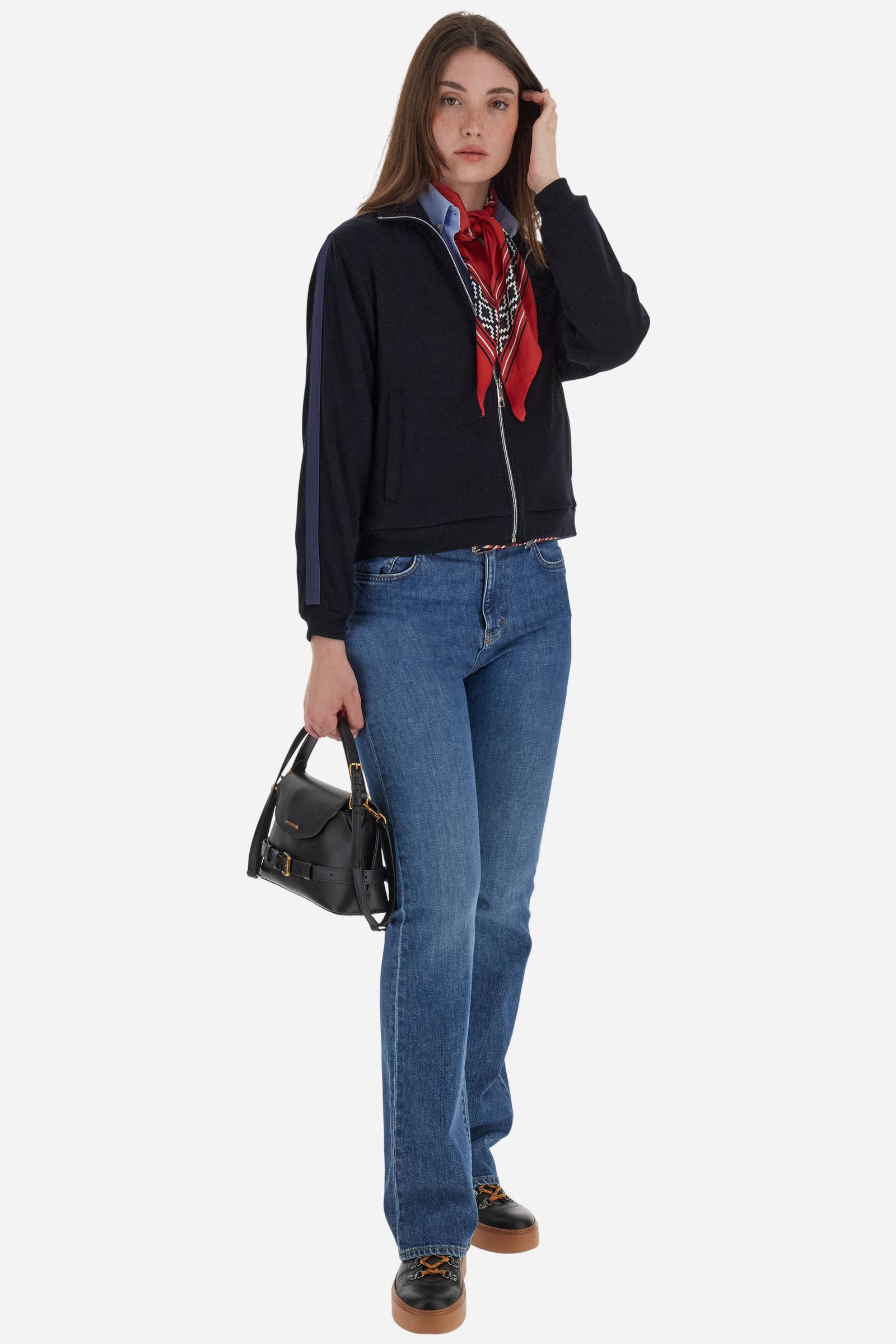 Women’s full-zip sweatshirt with long sleeves in soft interlock viscose blend, offering a luxurious feel on the skin. Straight cut with fluid line and sport-luxury details. Striped bands on the sleeves and heraldic embroidery on the chest add a contemporary touch. The model wears size 2. - Navy