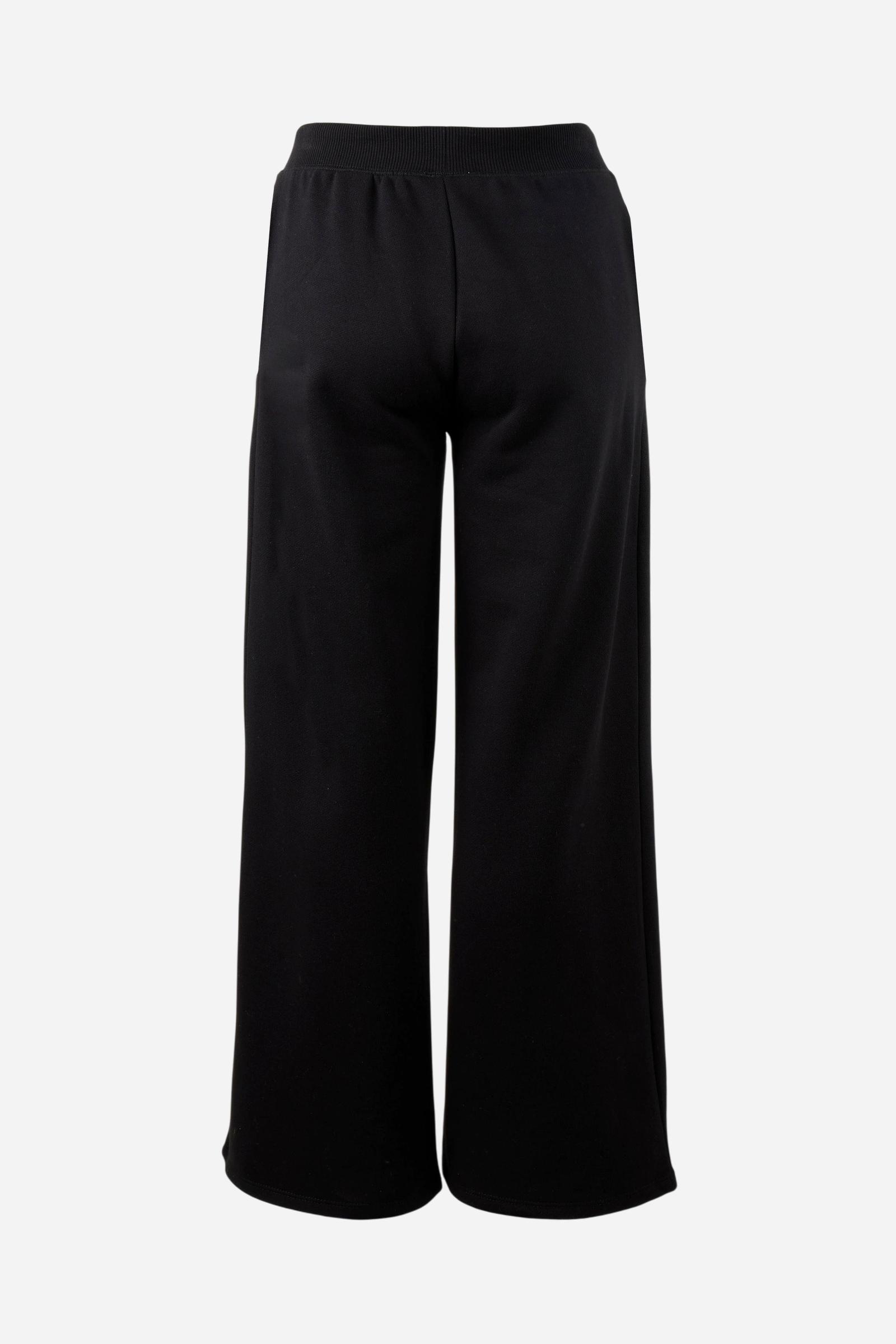 Women's pants in soft brushed cotton with an elastic waistband, adjustable drawstring, vertical side pockets, and a relaxed wide-leg fit for all-day comfort. - Black