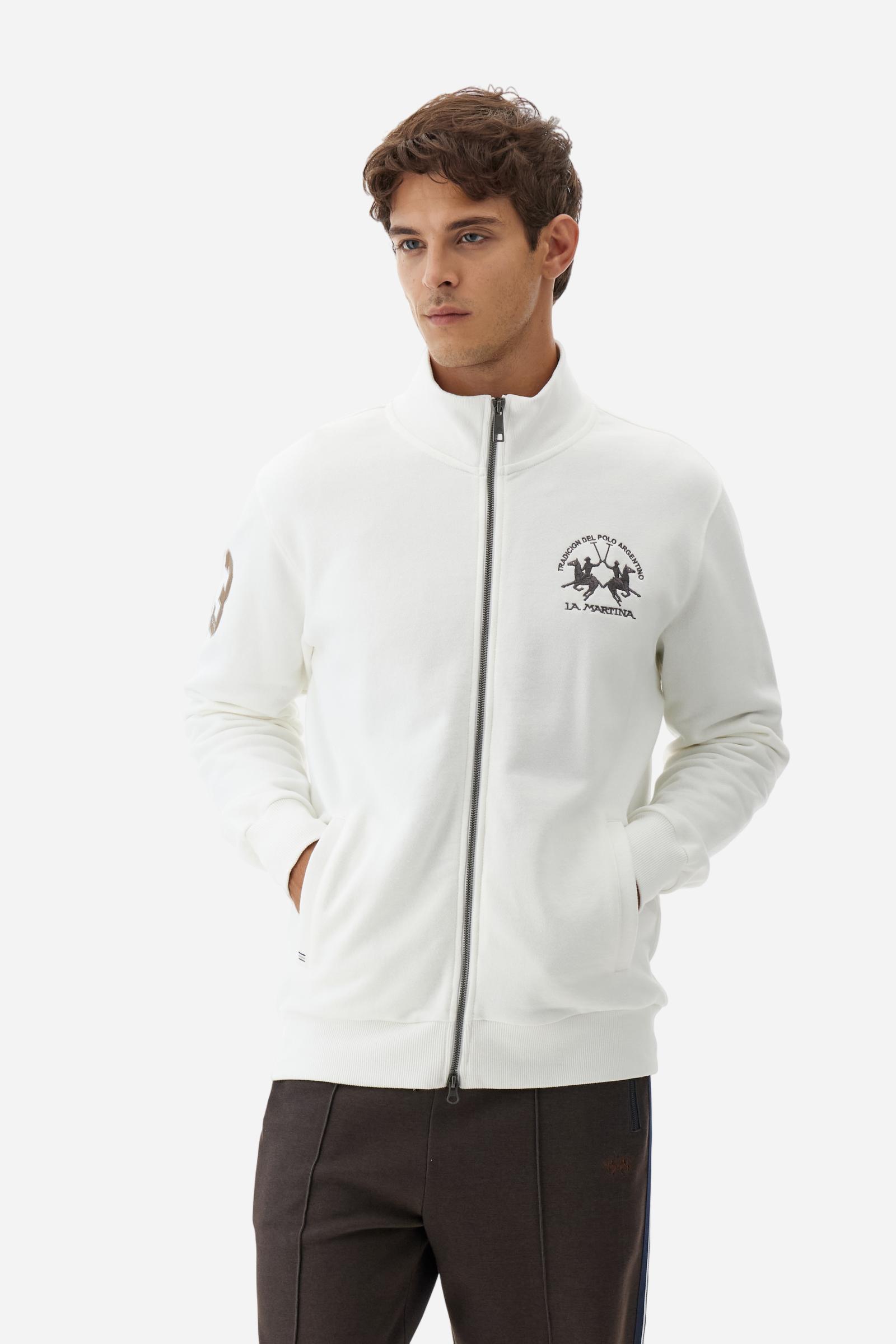 Men's long-sleeved solid colour sweatshirt. It is made of comfortable 100% cotton fleece with a soft-brushed feel. Model with high ribbed neck and front zip opening. Solid colour ribbed cuffs and waistband. The large contrasting brand team logo is embroidered on the chest. A contrasting colour fabric number patch is applied to the right sleeve. The model has a regular fit that offers a comfortable, relaxed silhouette. The model is wearing a size L. - Off White