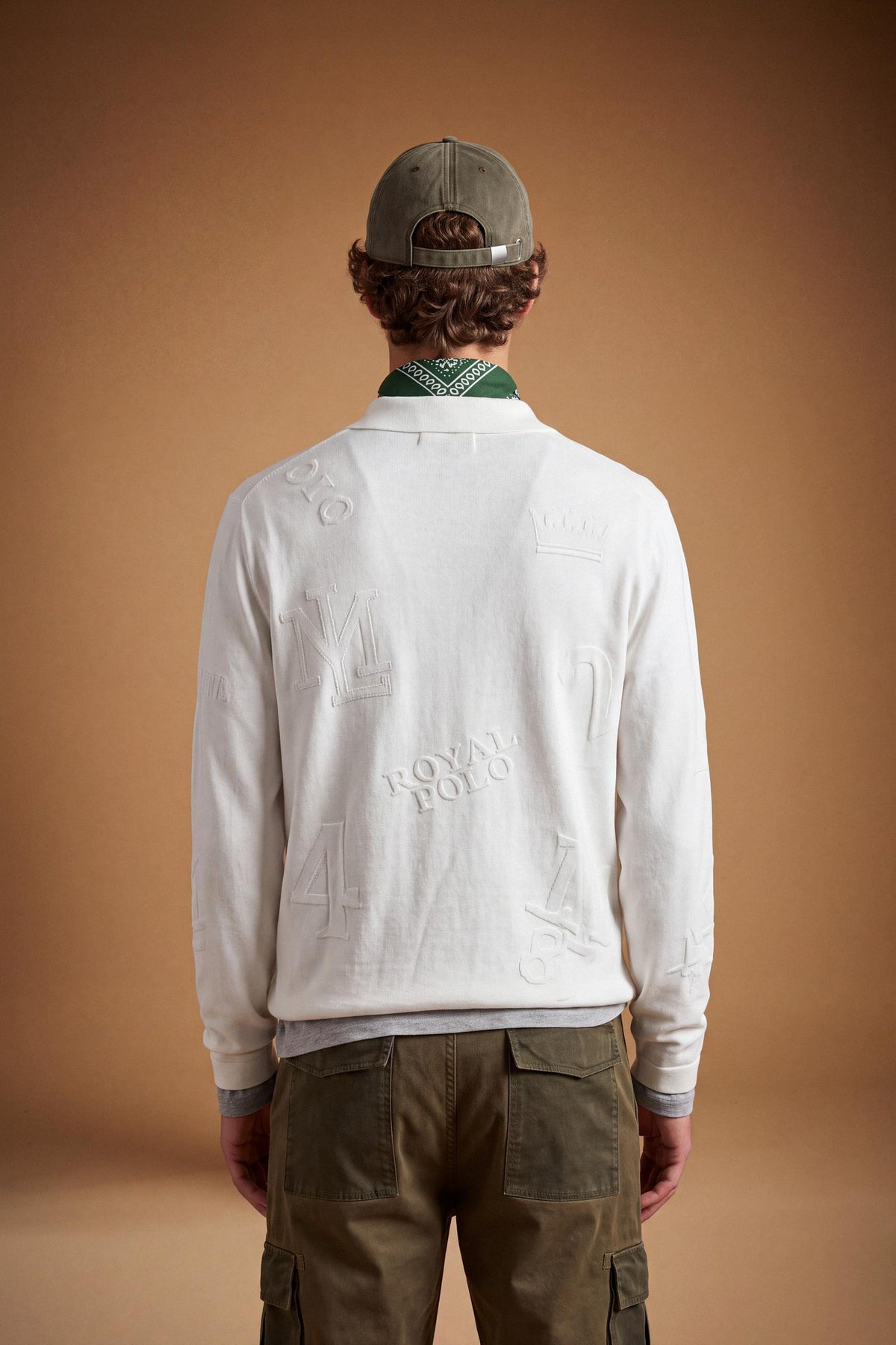 Men’s long-sleeve sweater in 100% combed cotton with a regular fit, jacquard knit patterns, ribbed cuffs and hem, a polo collar, and a three-button front opening. - Pristine