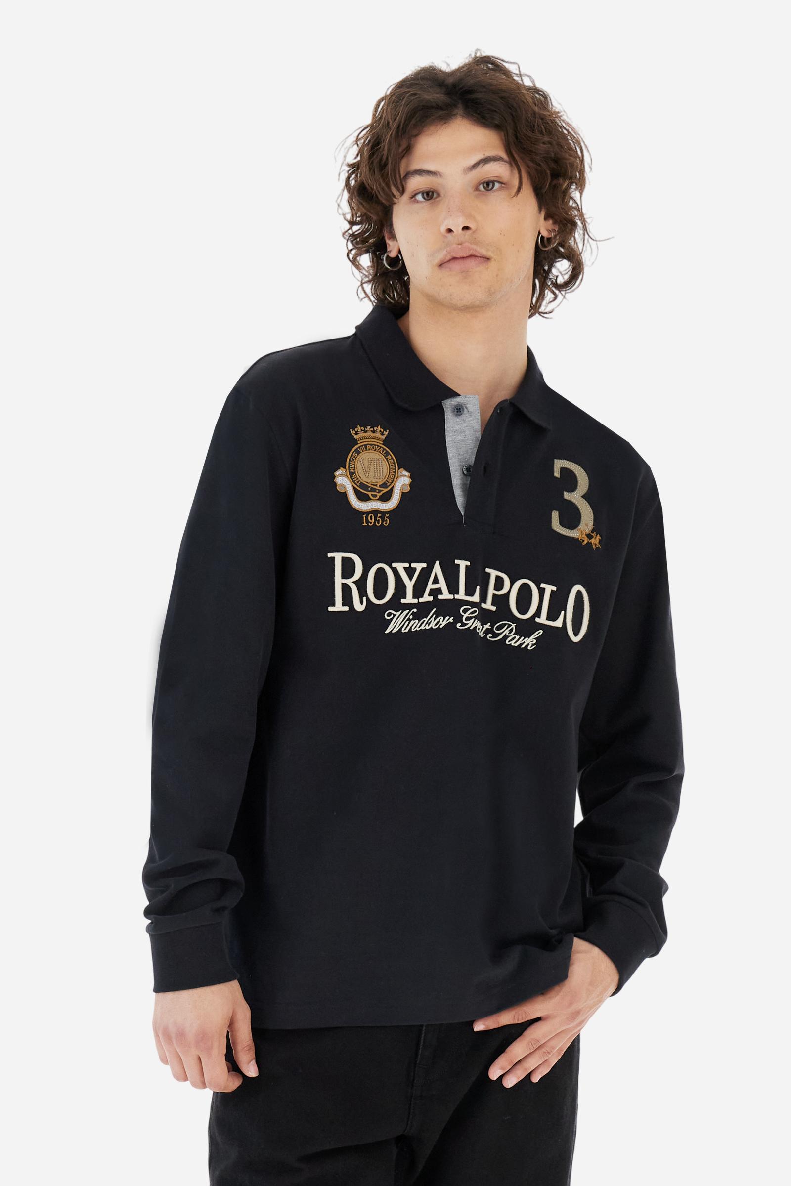 Men's long-sleeved solid colour, cotton jersey polo shirt. Two-button opening with contrasting details. Solid colour ribbed collar and cuffs. The chest features embroidered crests and lettering inspired by British royal heritage. The number 3 features on a patch with a fringed edge. The small brand logo is embroidered next to the number in contrasting colour. Regular fit. The model is wearing a size L. - Black