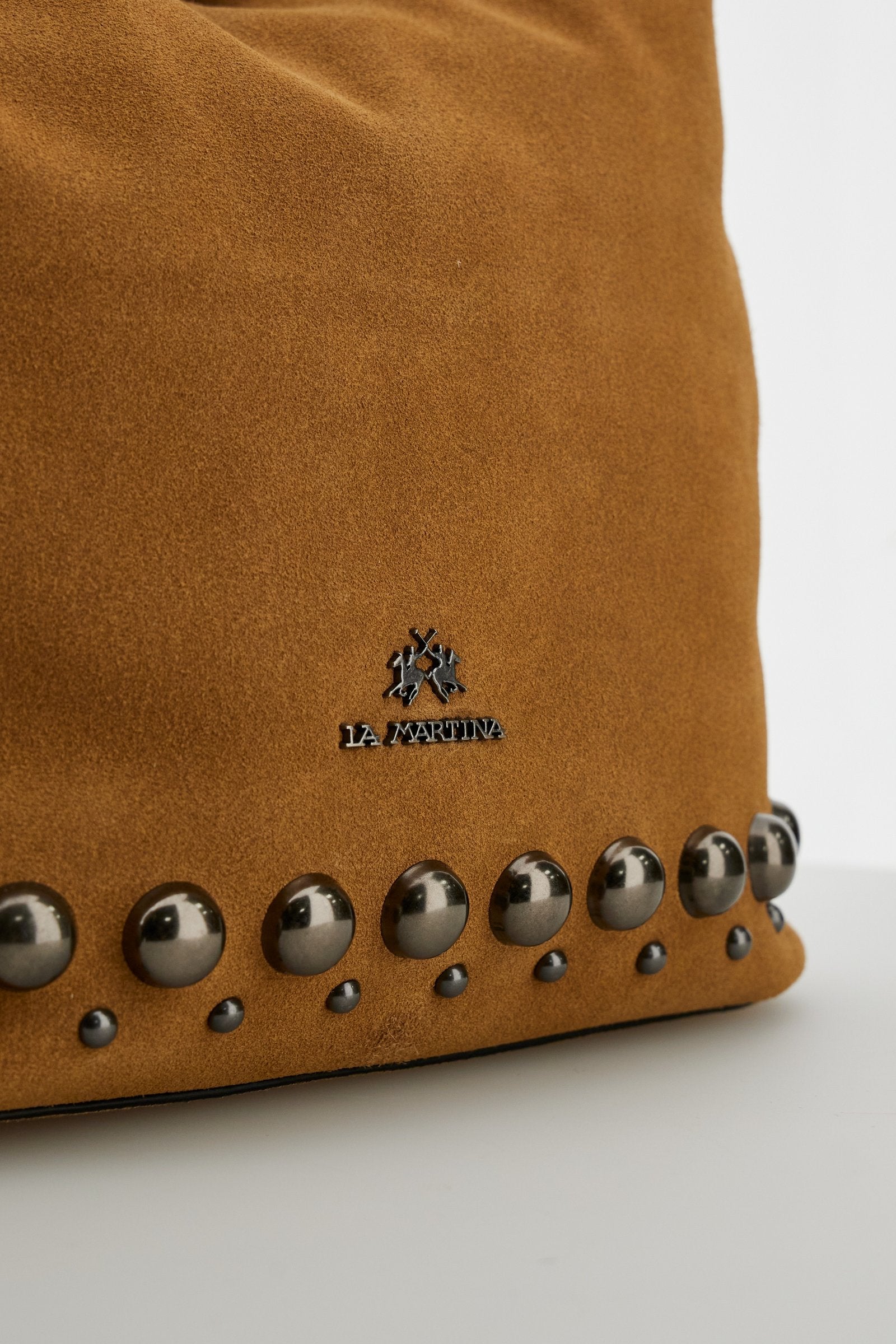 Soft suede hobo bag with leather trims, metal studs, spacious interior, zip pocket, and adjustable shoulder strap for durability and modern style. - Mou/Sienna