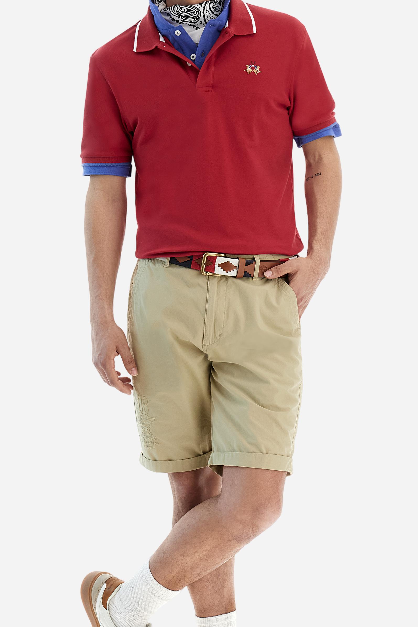 Short-sleeved, single-colour men's polo shirt made of stretch cotton piqué. Fastens with two buttons.  The collar and cuffs are ribbed, and there is a colour-contrasting trim at the bottom of the collar.  Inside the collar there is a grosgrain ribbon of a different shade. The logo is embroidered on the chest in a contrasting colour. The fit is slim. The model is wearing a size L. - Formula One