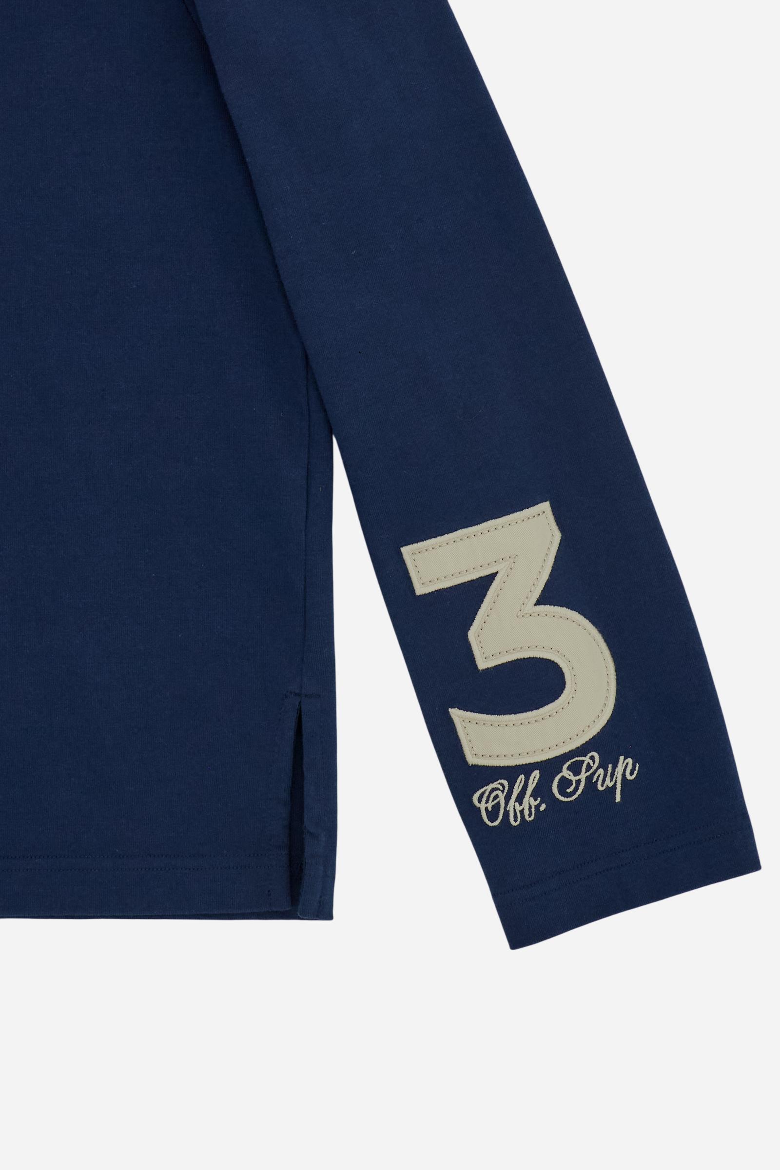 Women’s long-sleeve polo made from high-weight 100% cotton jersey, compact and structured. Featuring a four-button placket and ribbed collar, it is enriched with bold graphics and contrast LM embroidery on the chest alongside the brand logo. “Player” lettering and a maxi number 3 appear on the sleeves, while the back hem is finished with the brand’s signature detail. Relaxed, fluid fit. The model wears size 2. - Navy                                                                                            